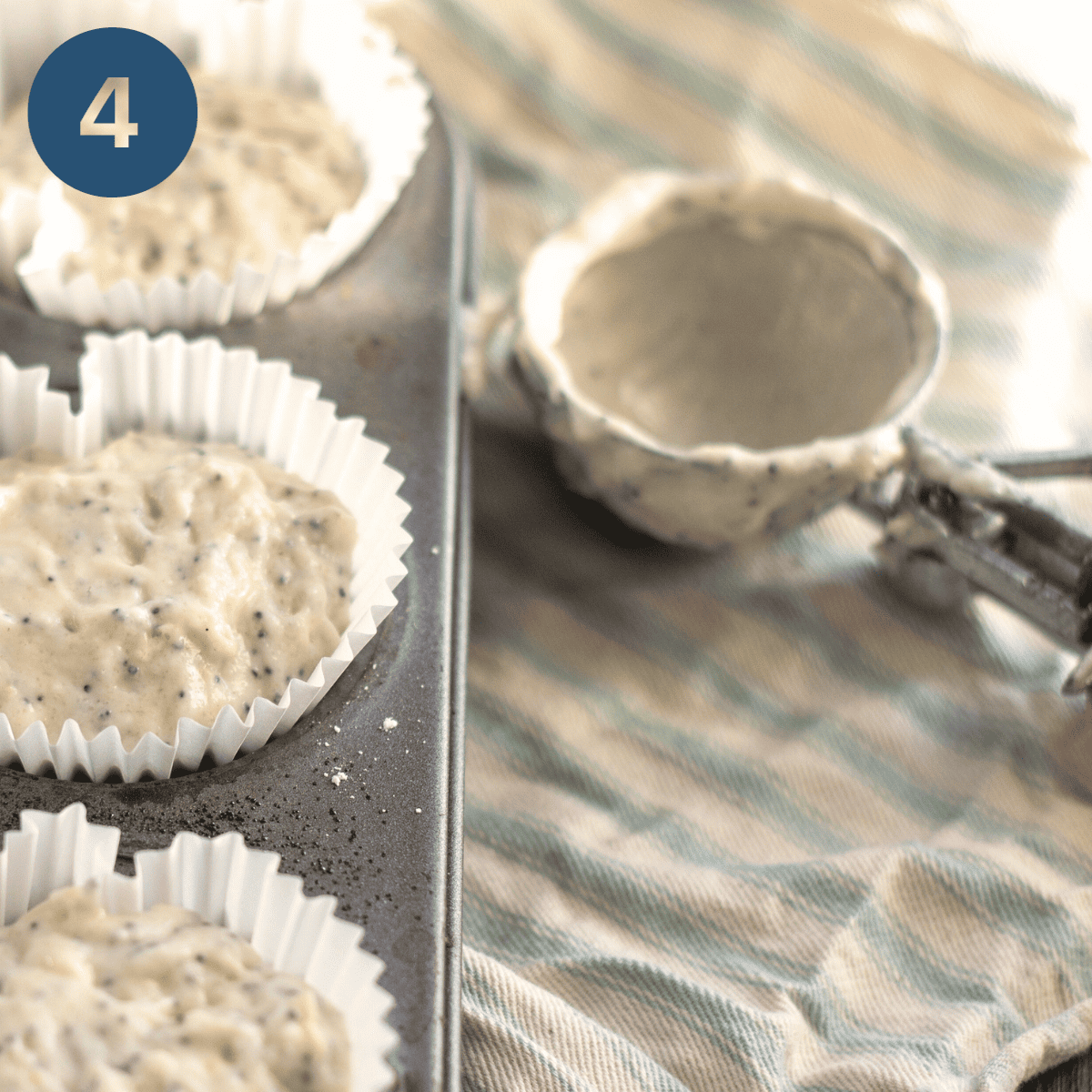 Putting lemon muffin batter into muffin cases.