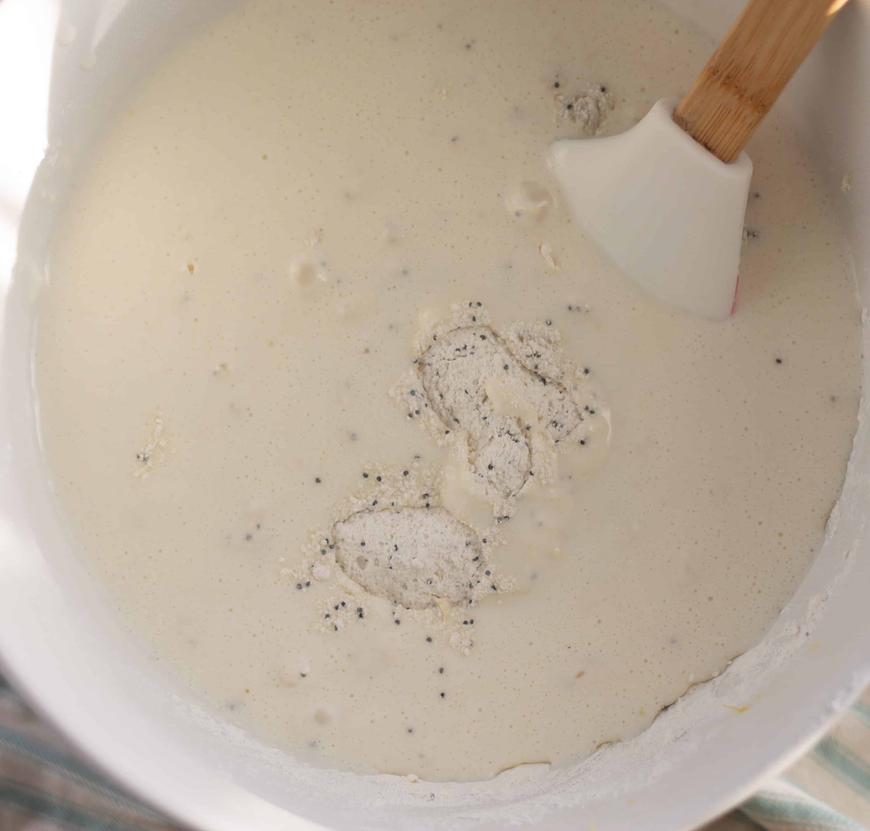Wet Ingredients being added to Lemon Muffins