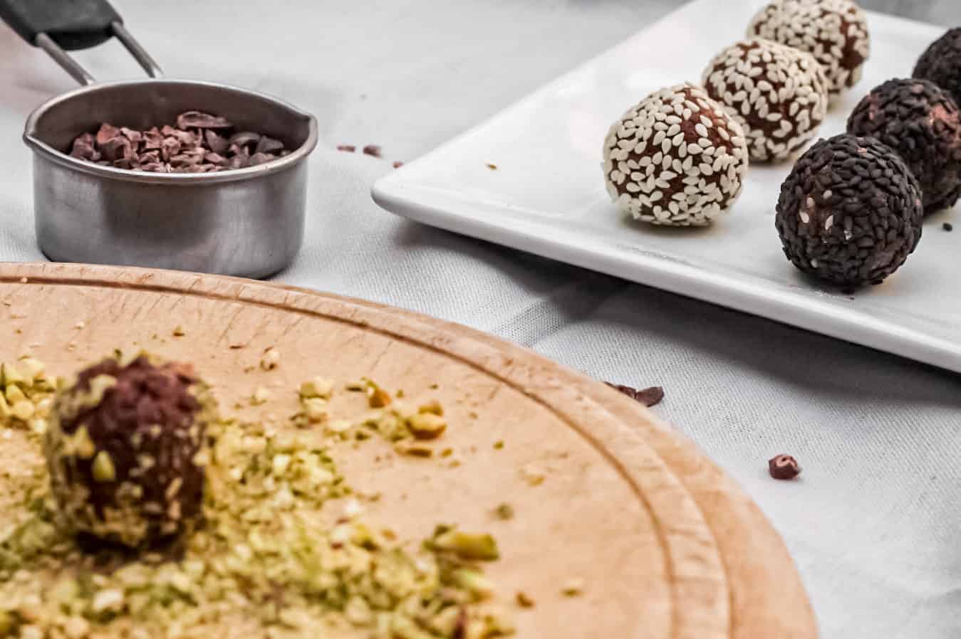 Cacao Truffles being rolled in pistachios