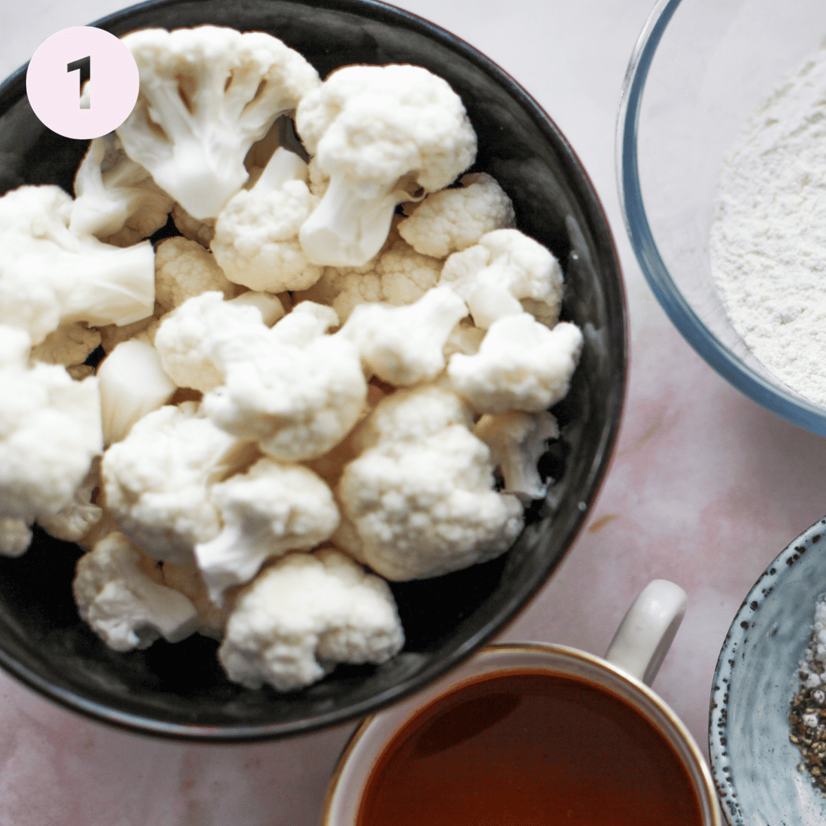 Prepaing cauliflower florets for batter.