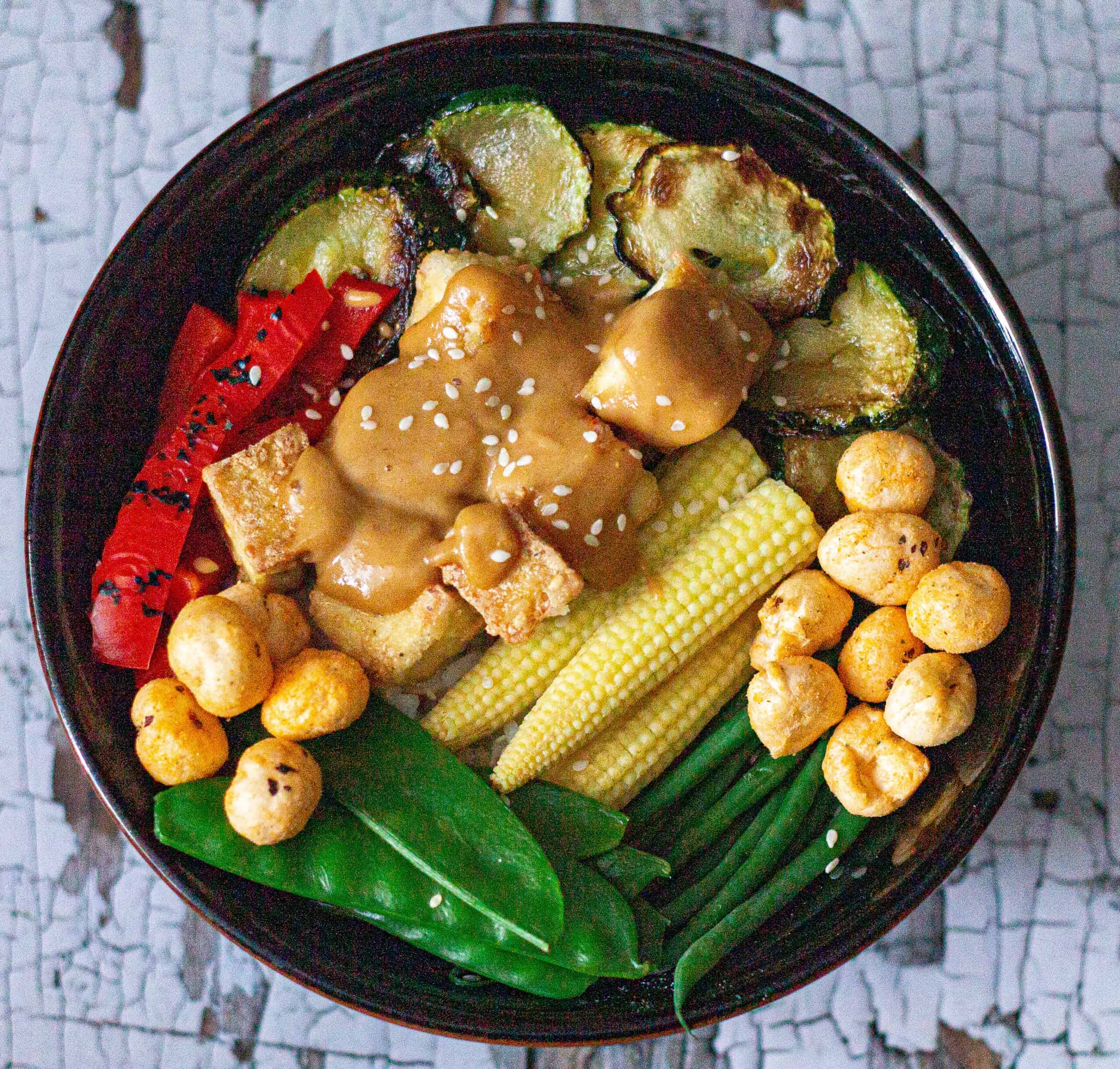 A tofu bowl with chick peas and green beans