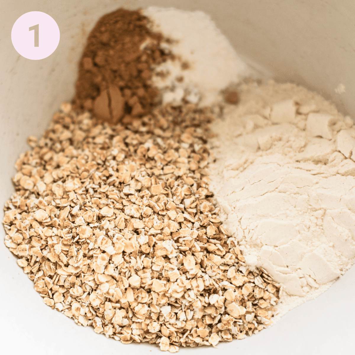 Mixing oats, flour and ginger in a large mixing bowl.