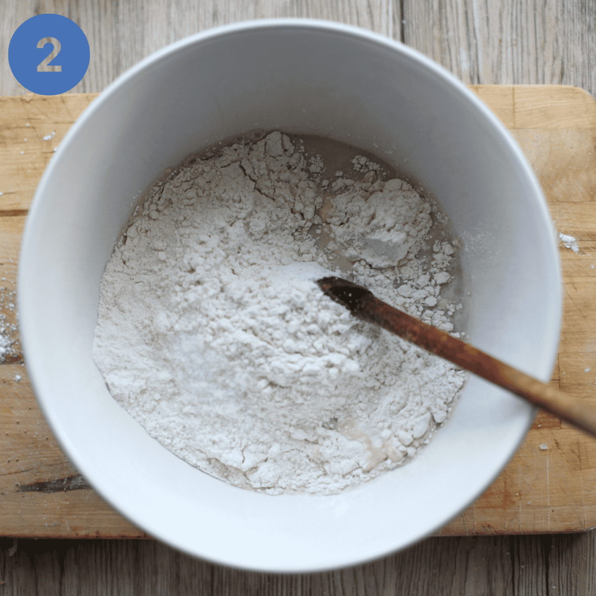 Adding flour to yeast mixture.
