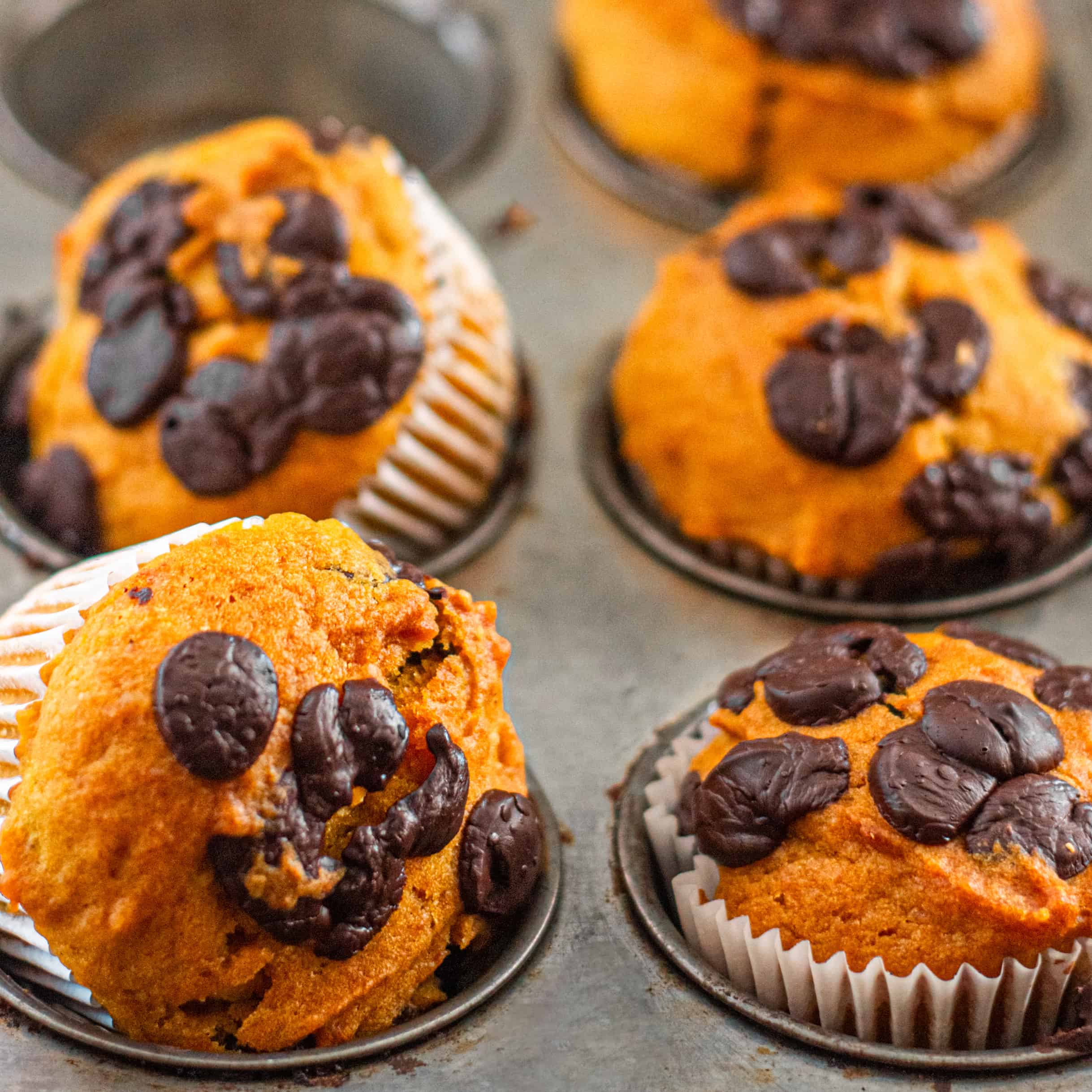 A baking tray of vegan pumpkin muffins.