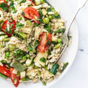 Pasta Primavera in a bowl with a fork