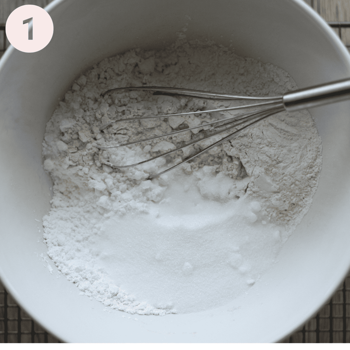Whisking flour and cornflour for waffles.