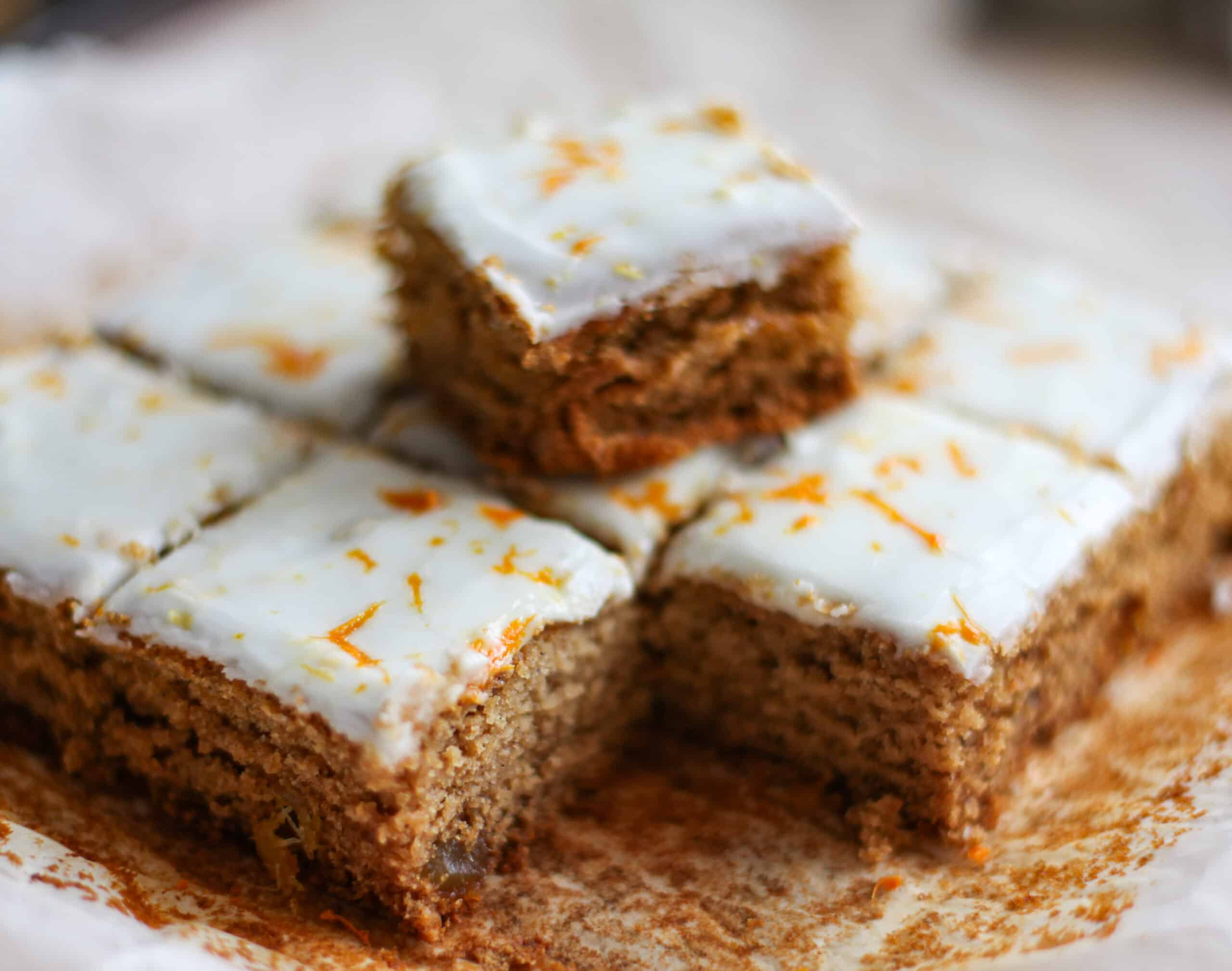 A plate of gingerbread cake, cut into squares.