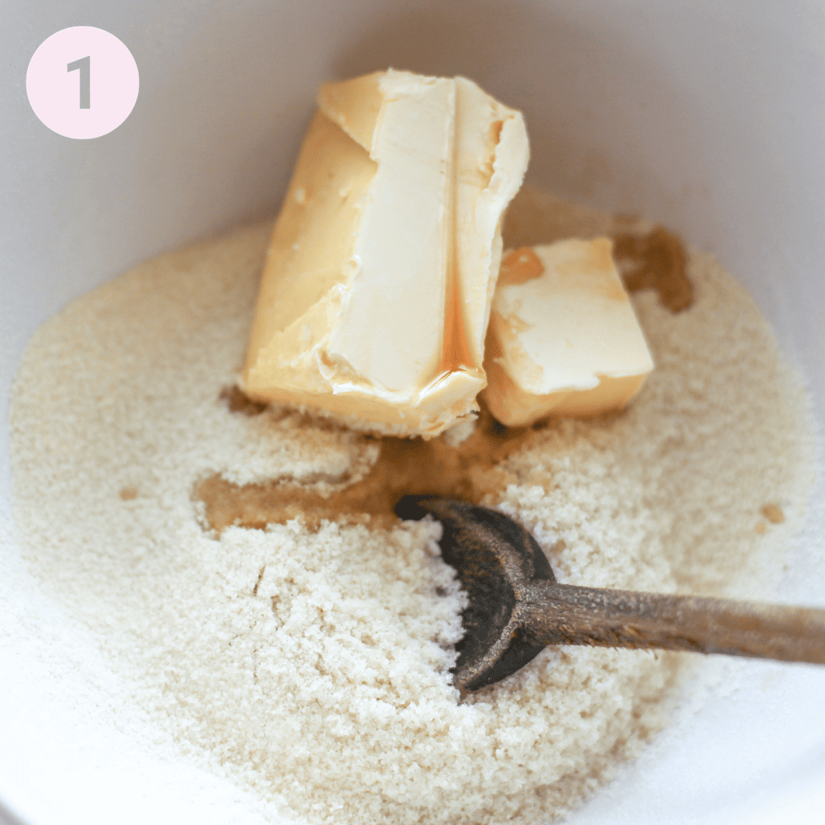 Mixing butter, flour and sugar in a bowl.