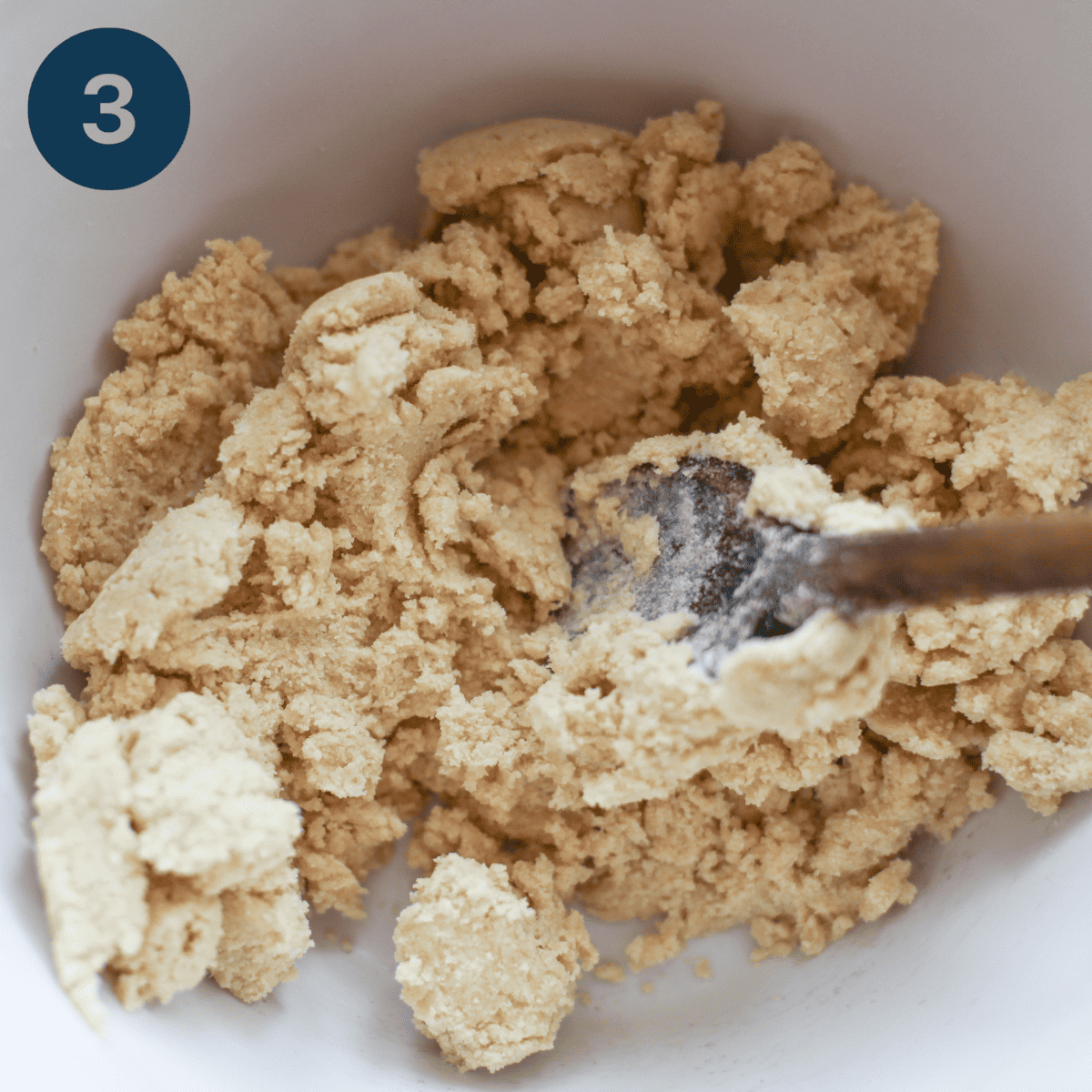 Mixing shortbread dough in a mixing bowl.