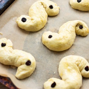 Saffron Buns on a baking tray ready to be baked