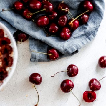 a collection of fresh cherries and smoothie bowl