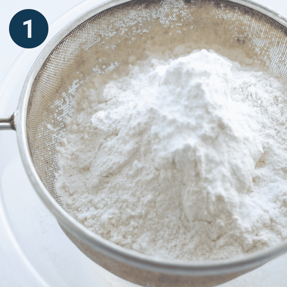 Sifting flour for banana loaf