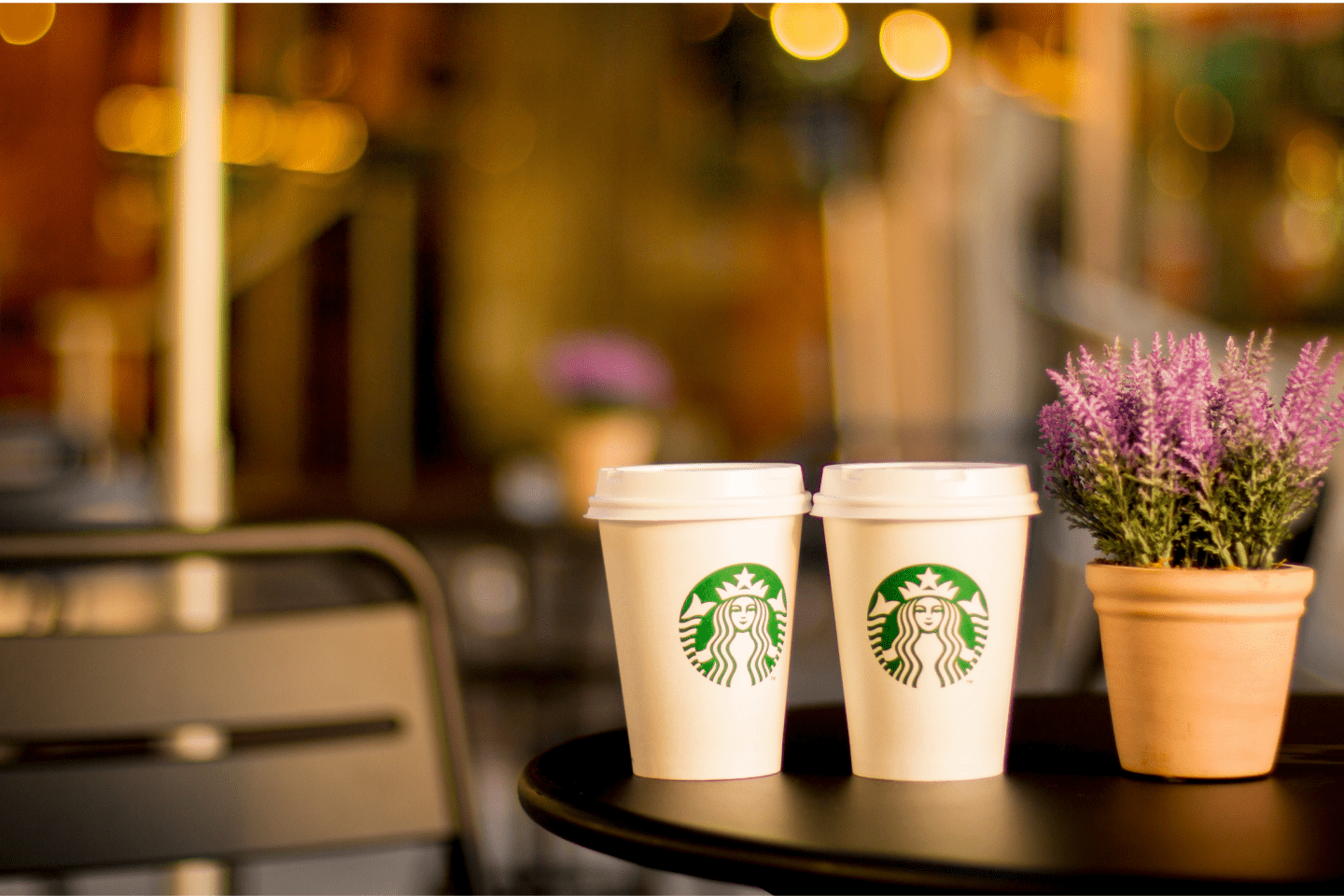 Two Starbucks Cups on a table