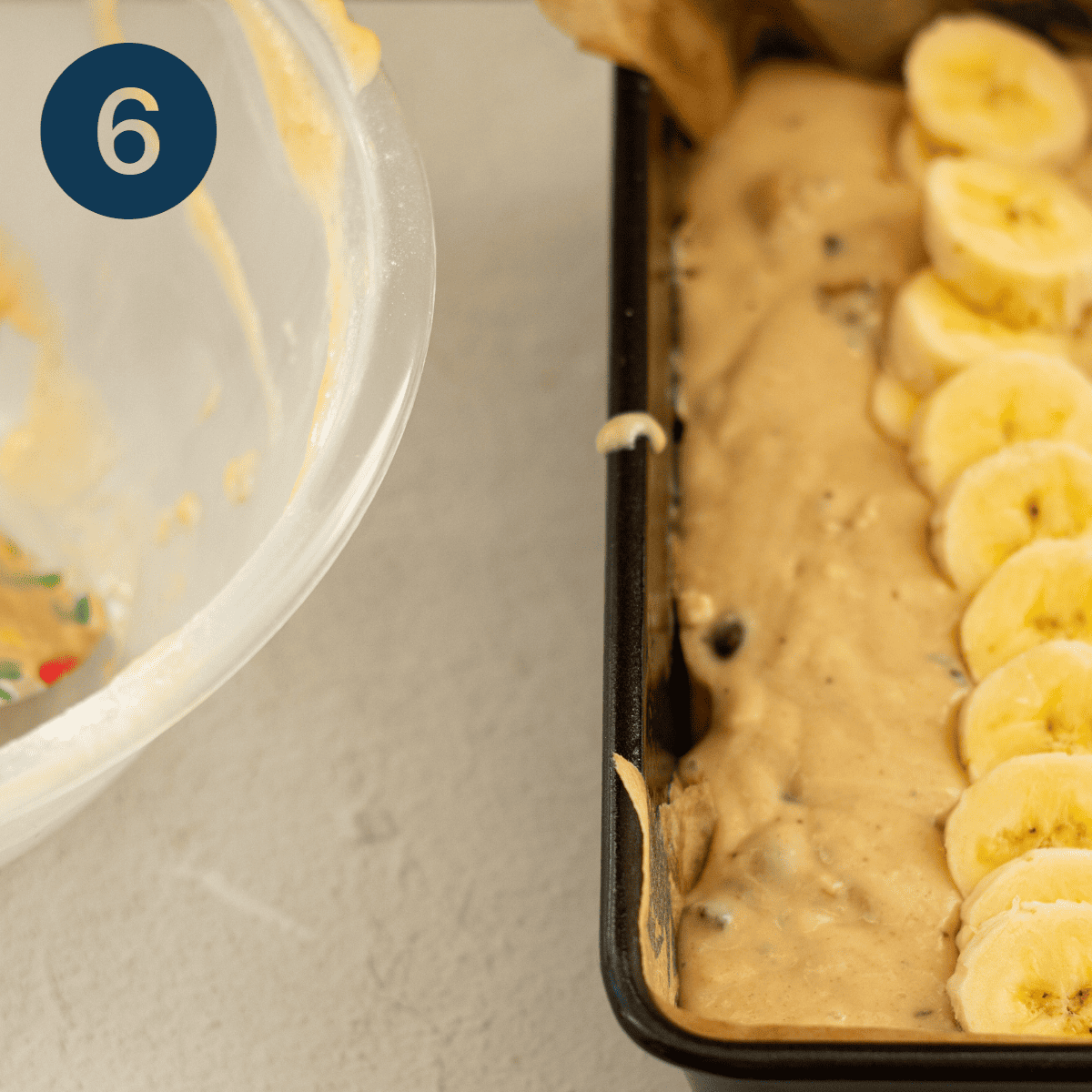 Pour banana bread batter into a prepared loaf tin.