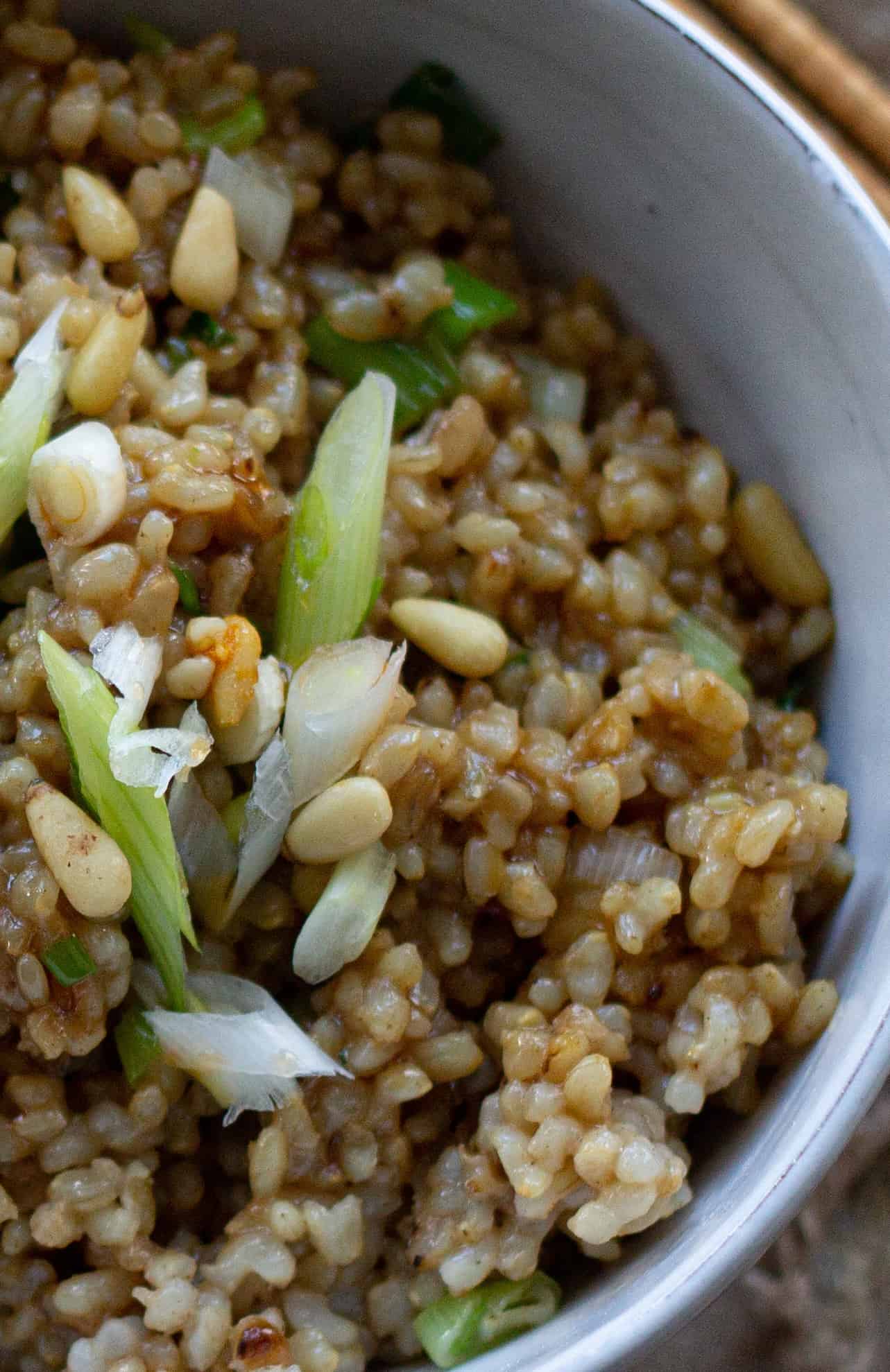 A close up of a bowl of brown rice