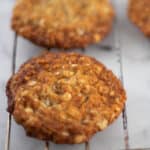 A single Anzac Cookie on a tray