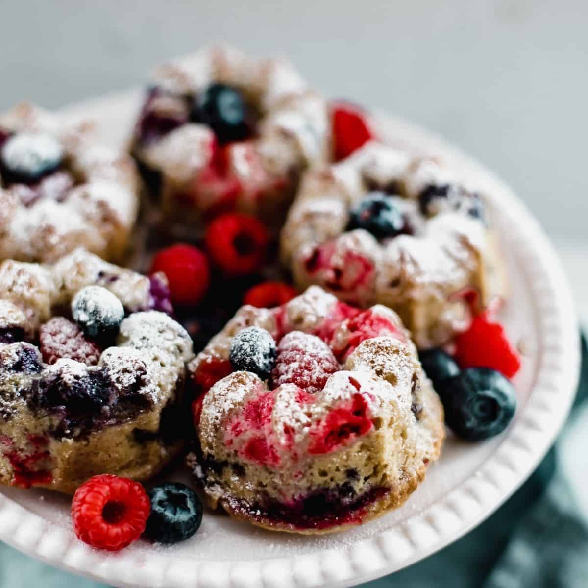 A cake stand with bundt cakes