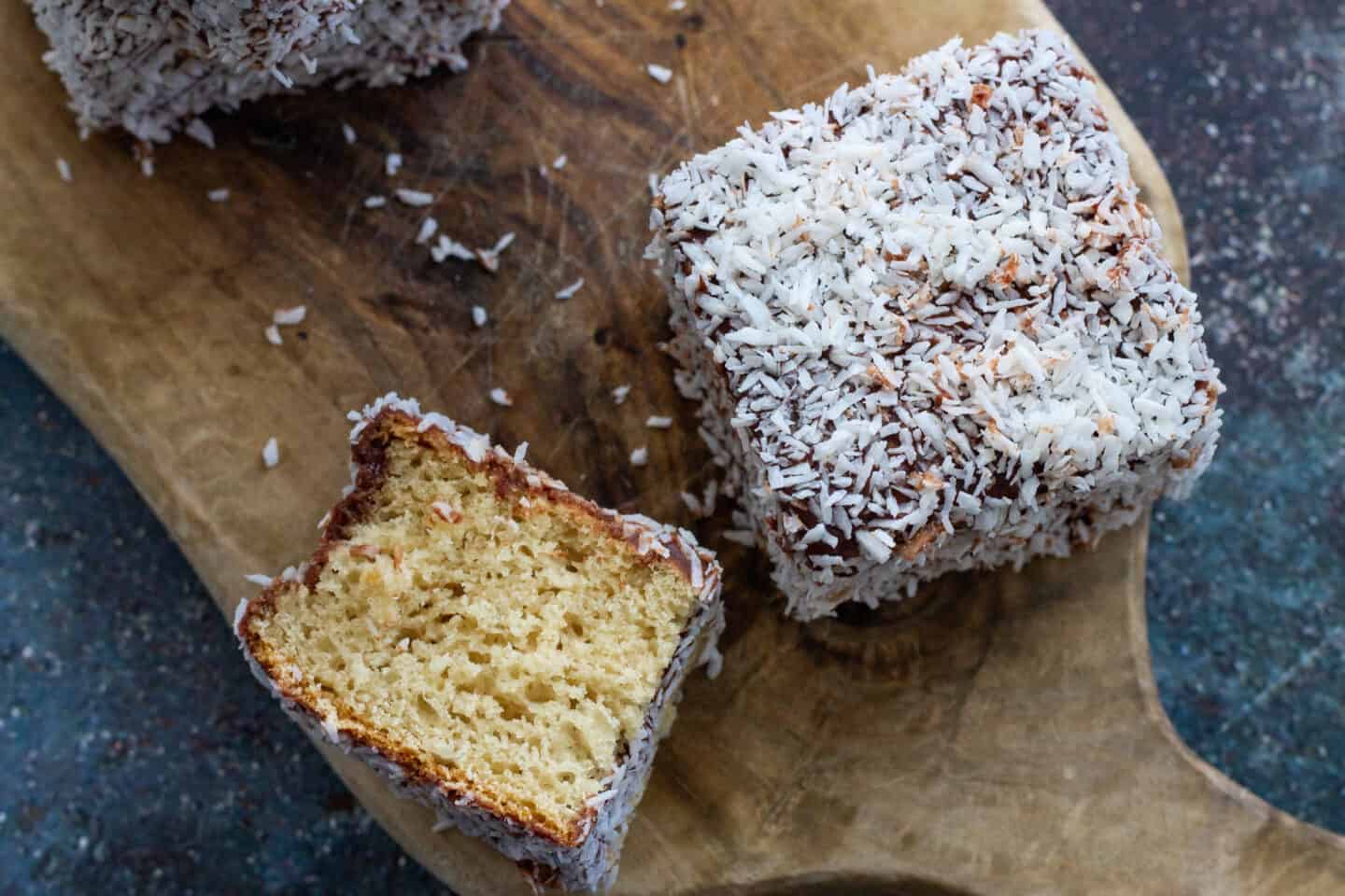 A group of lamington squares on a chopping board
