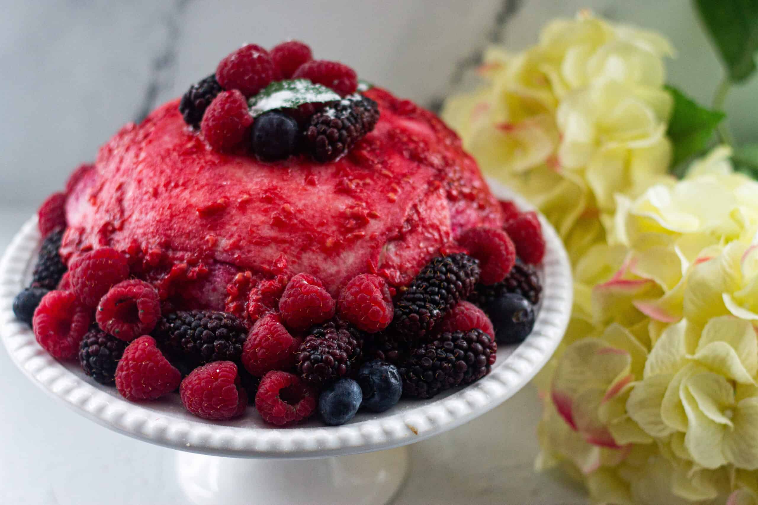 A large summer pudding on a serving plate