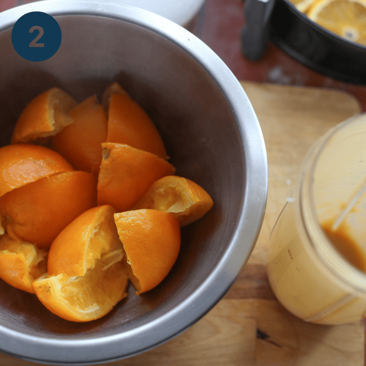 Cutting oranges up for blending.