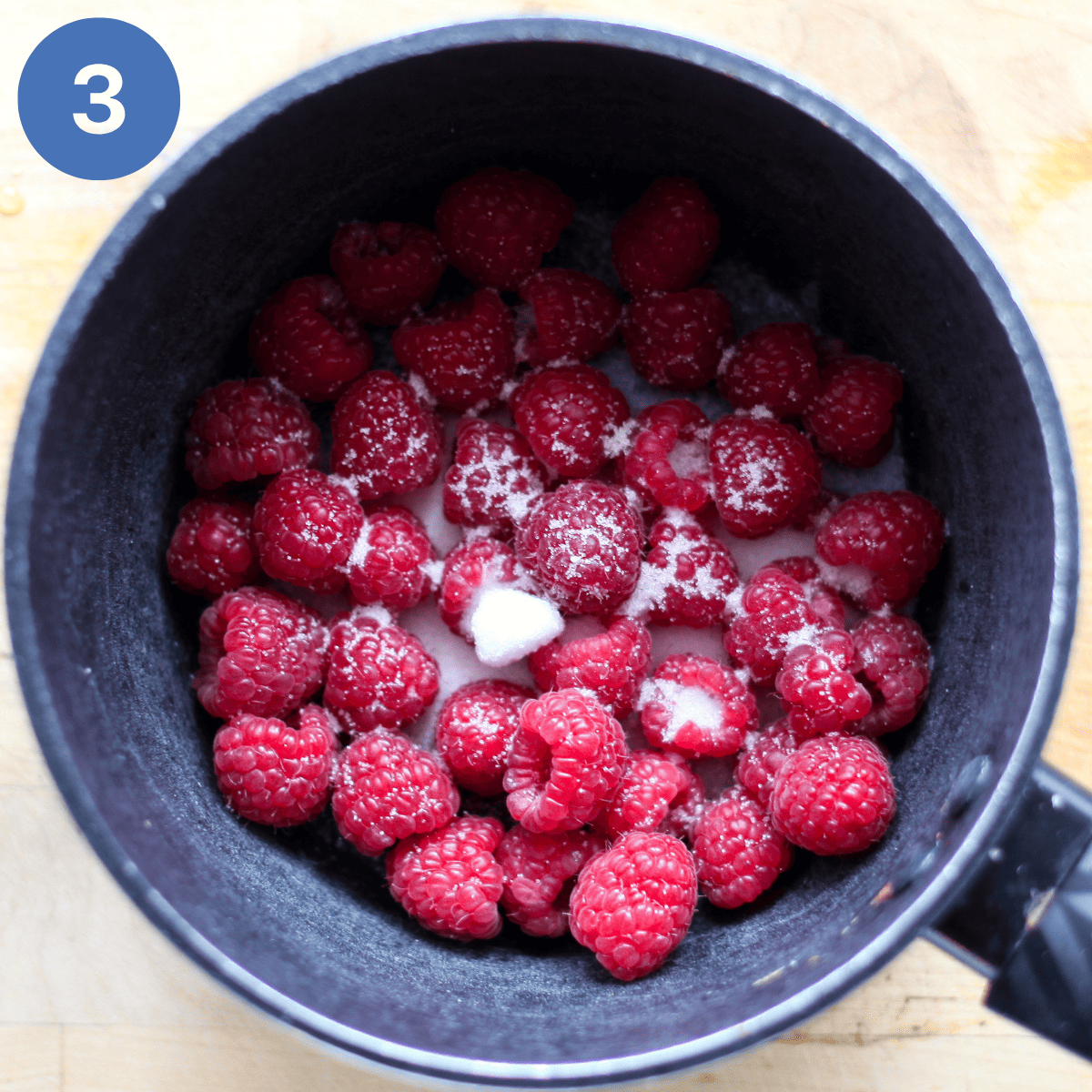 Stewing down raspberries for cranachan.