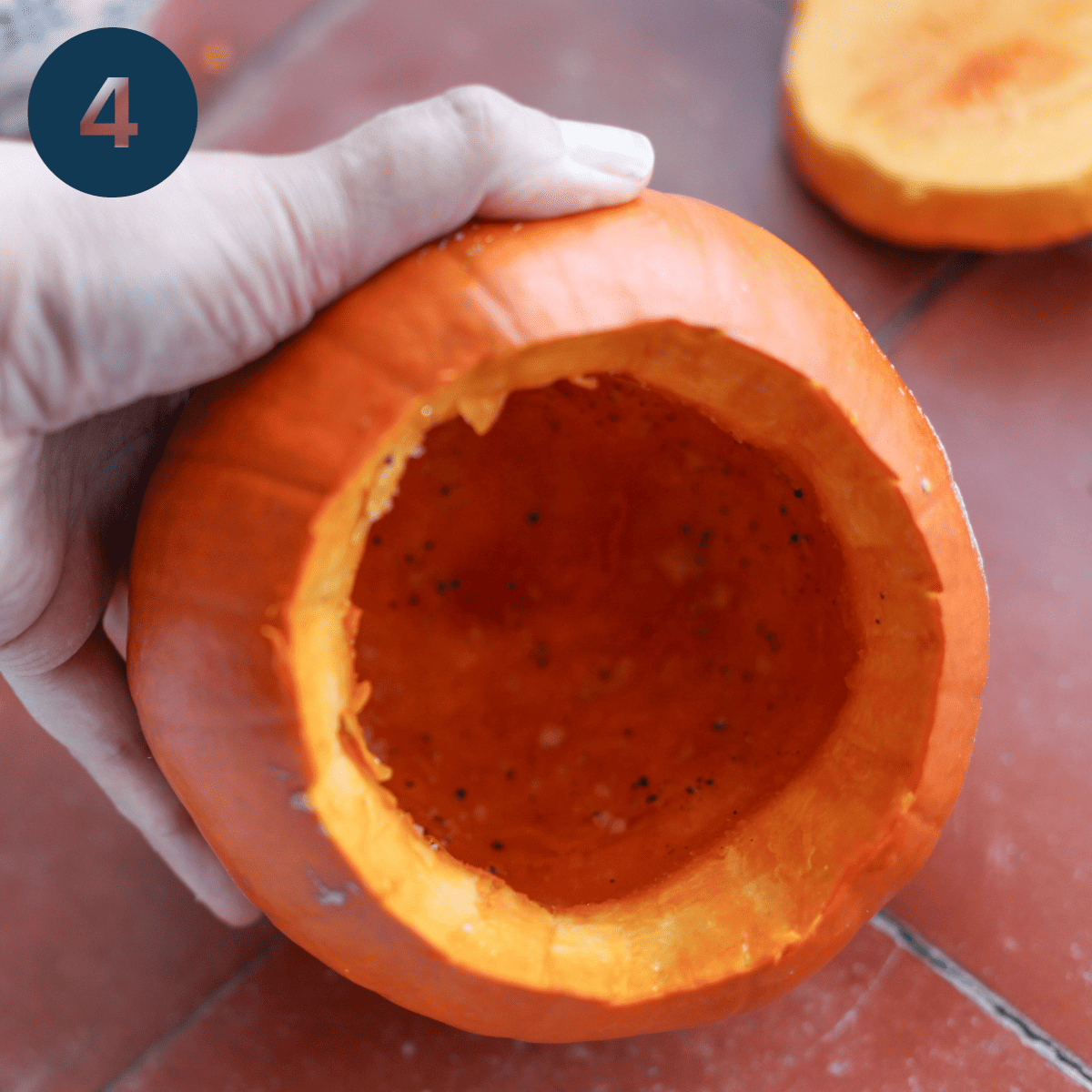 Seasoning the inside of a pumpkin.
