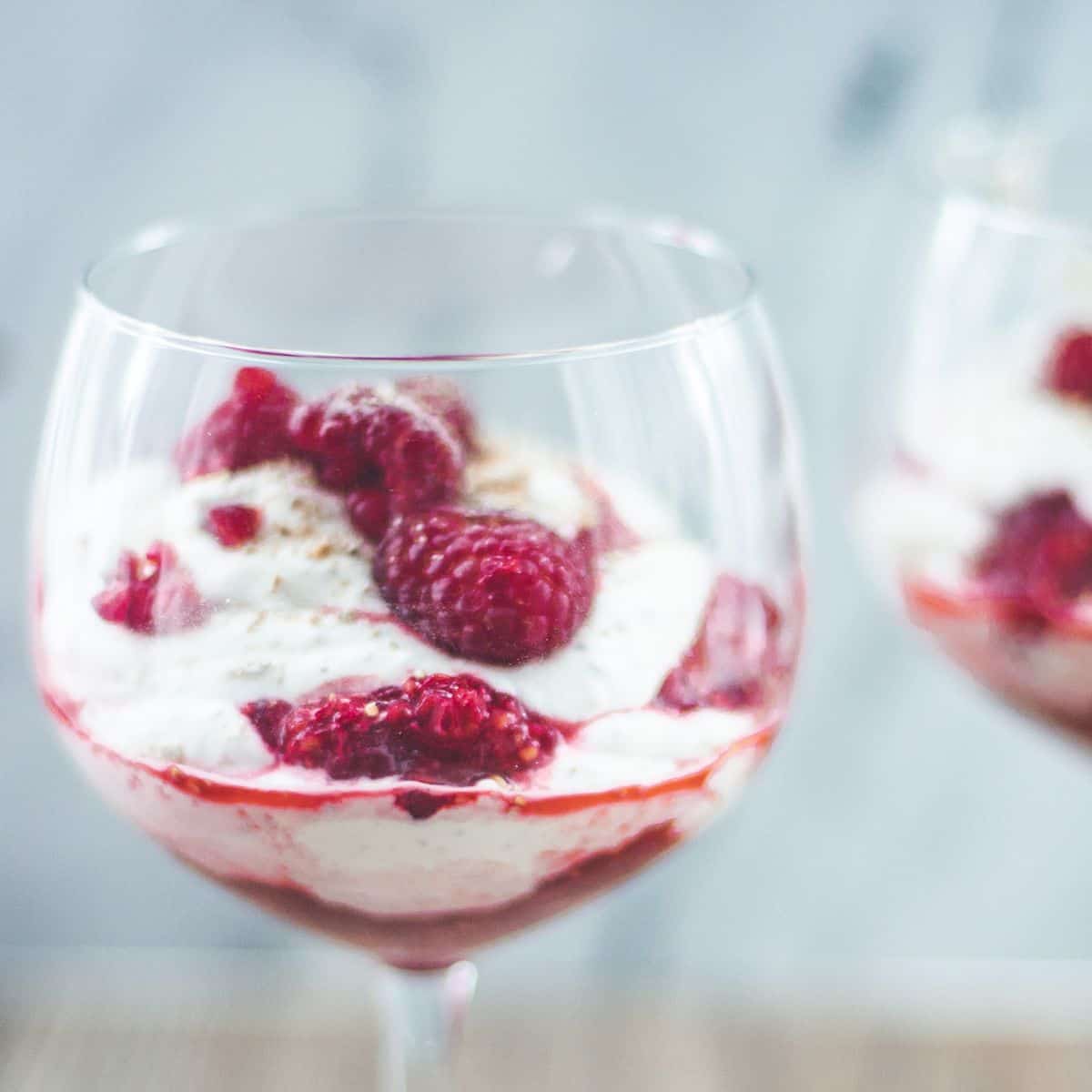 A serving glass filled with Cranachan