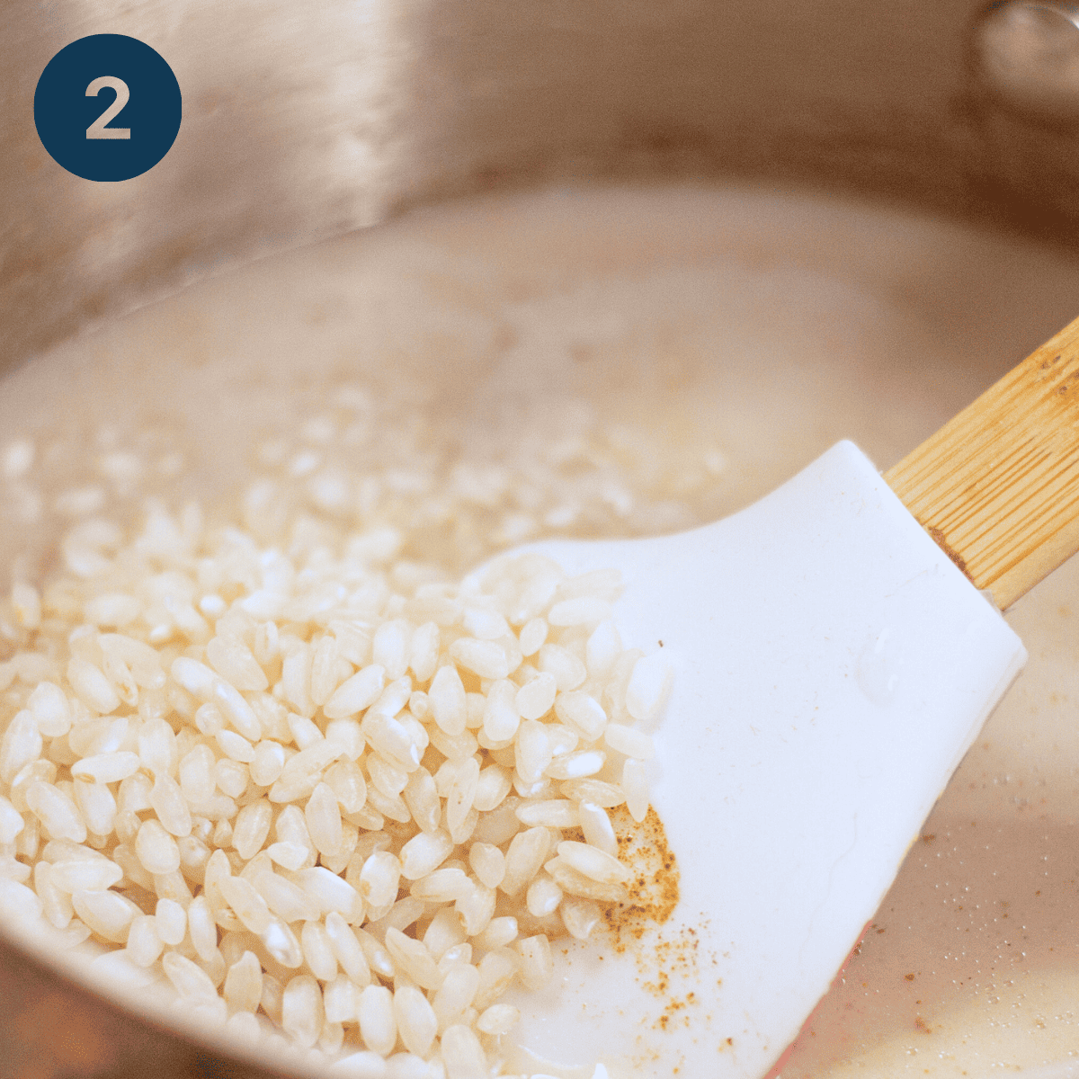 Adding rice to simmering milk.
