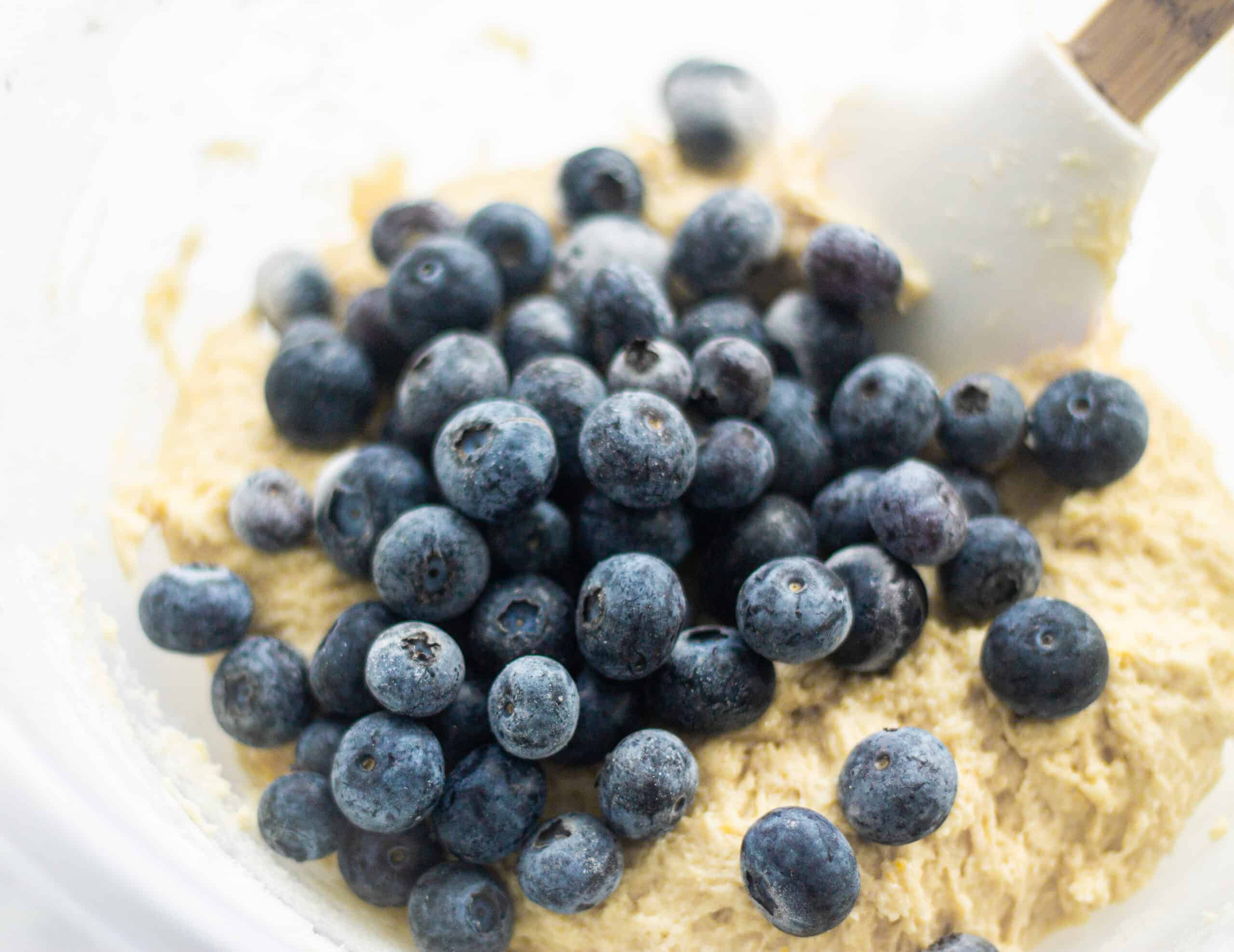 Folding the blueberries into muffin batter