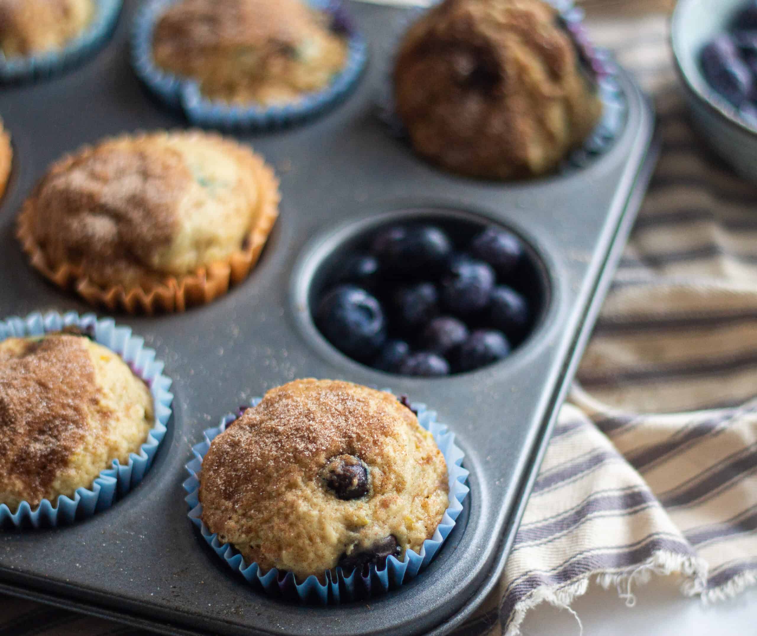 A tray full of blueberry muffins