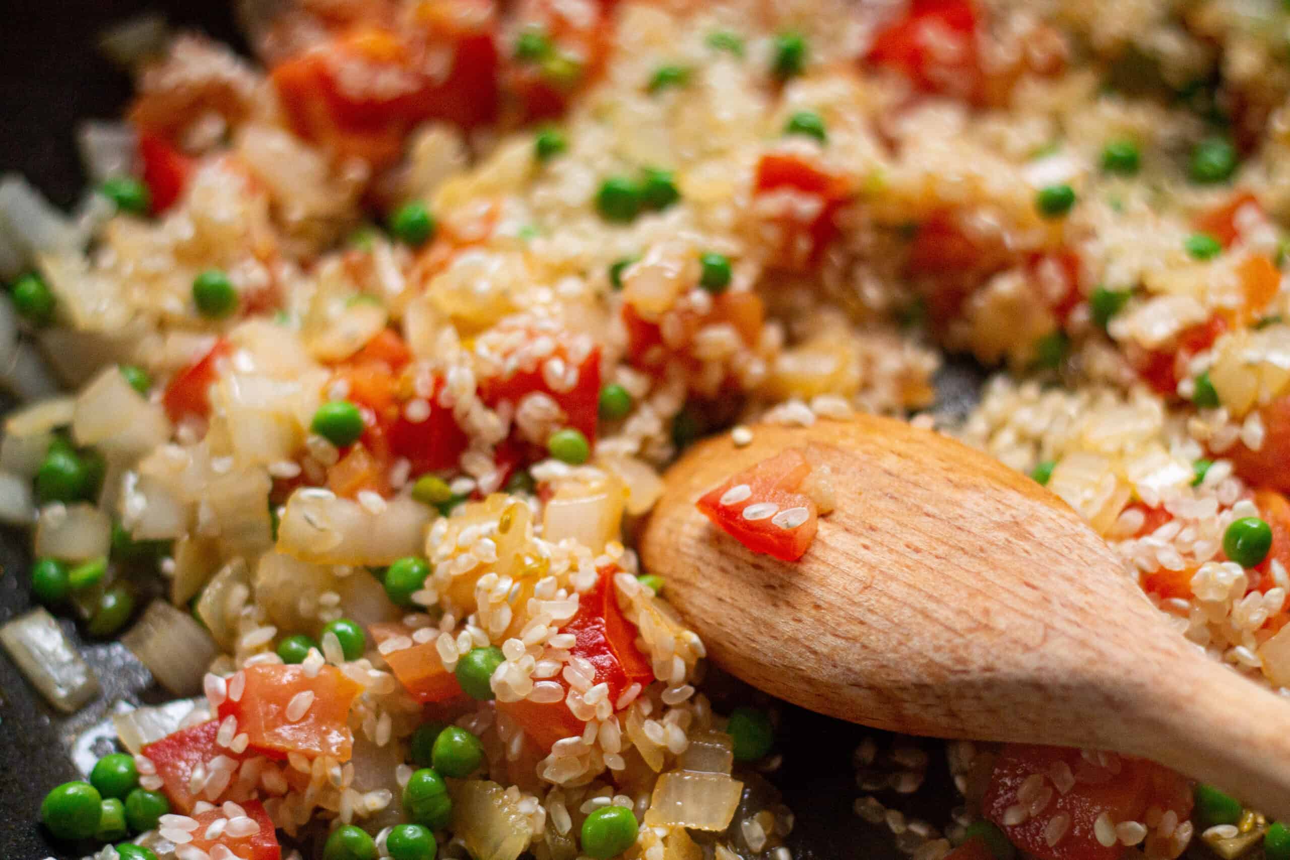 paella method , adding the rice