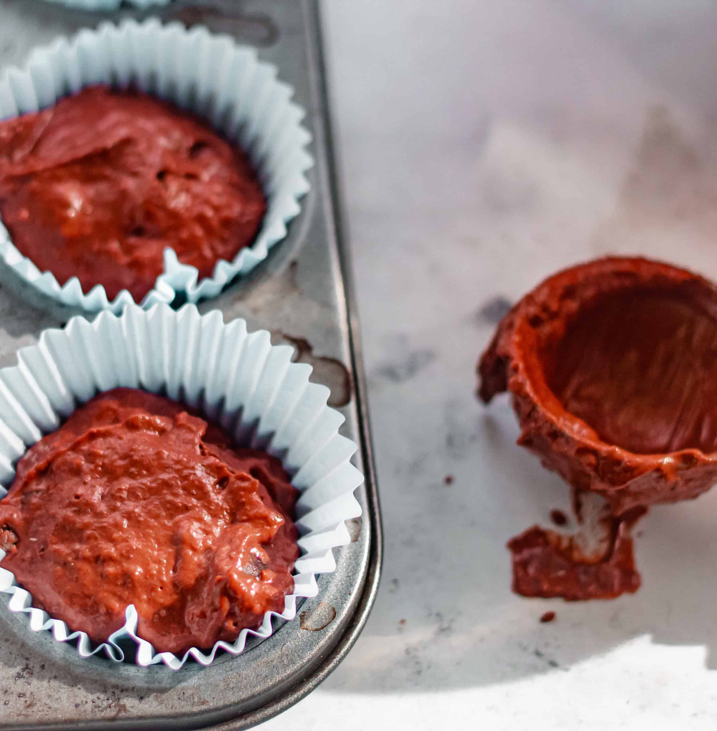 Muffin batter in the tin ready to bake