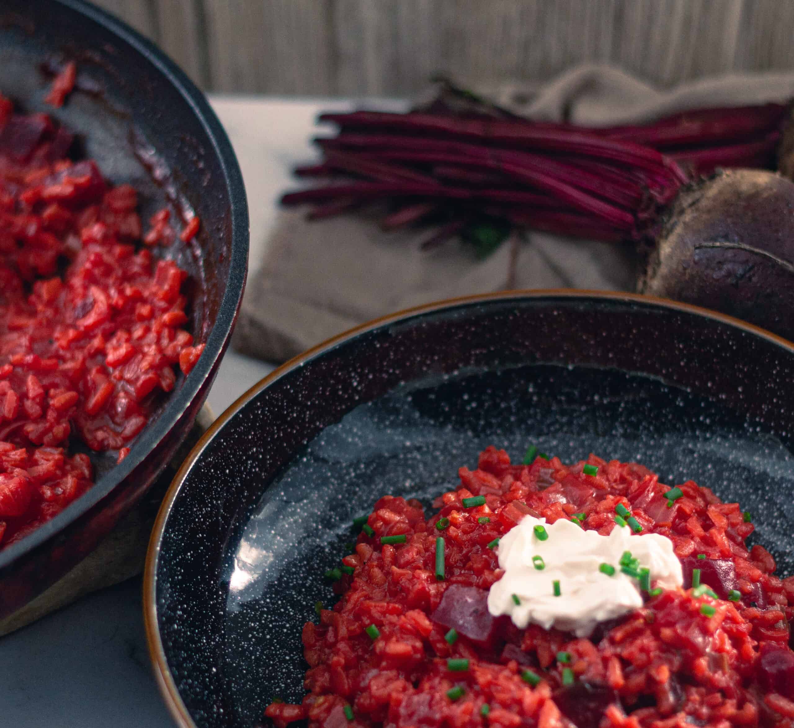 Two bowls of beetroot risotto