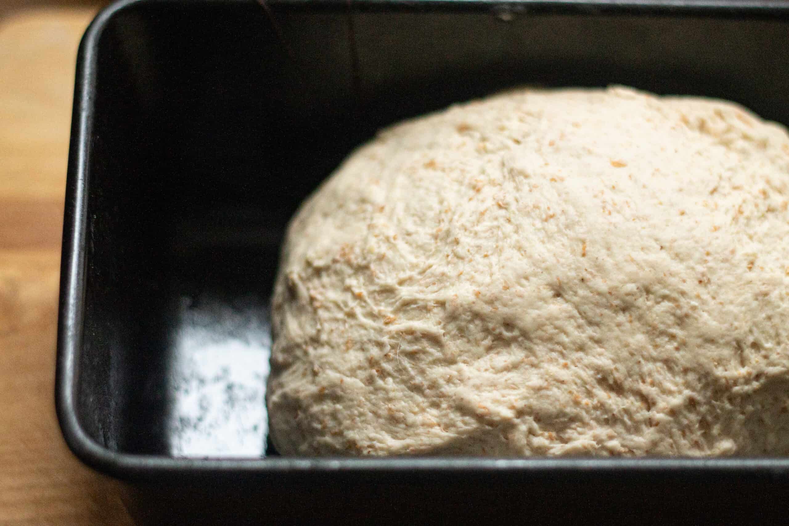 Bread dough in a loaf tin