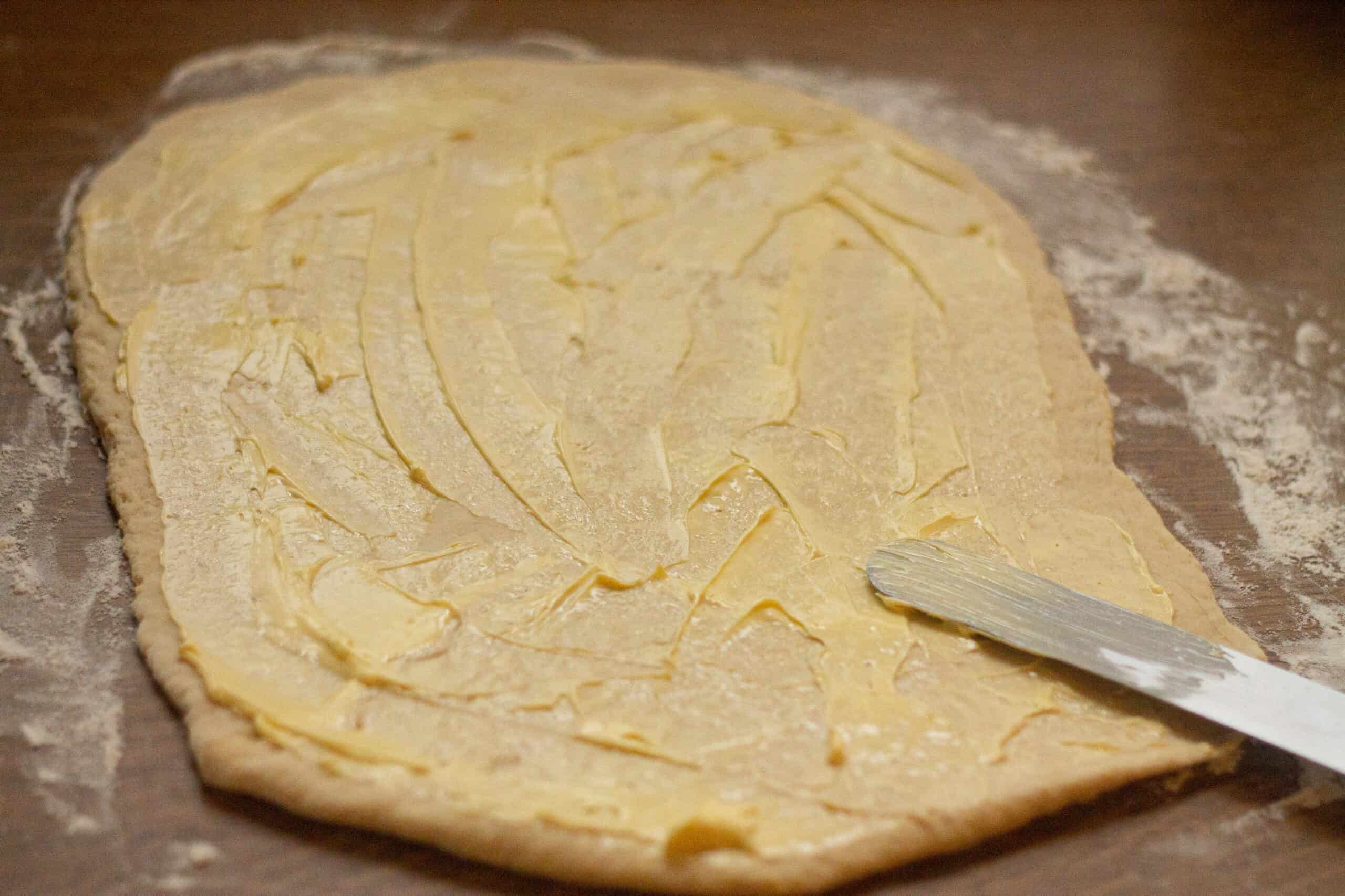 Chelsea Bun rolled out and spread with vegan butter