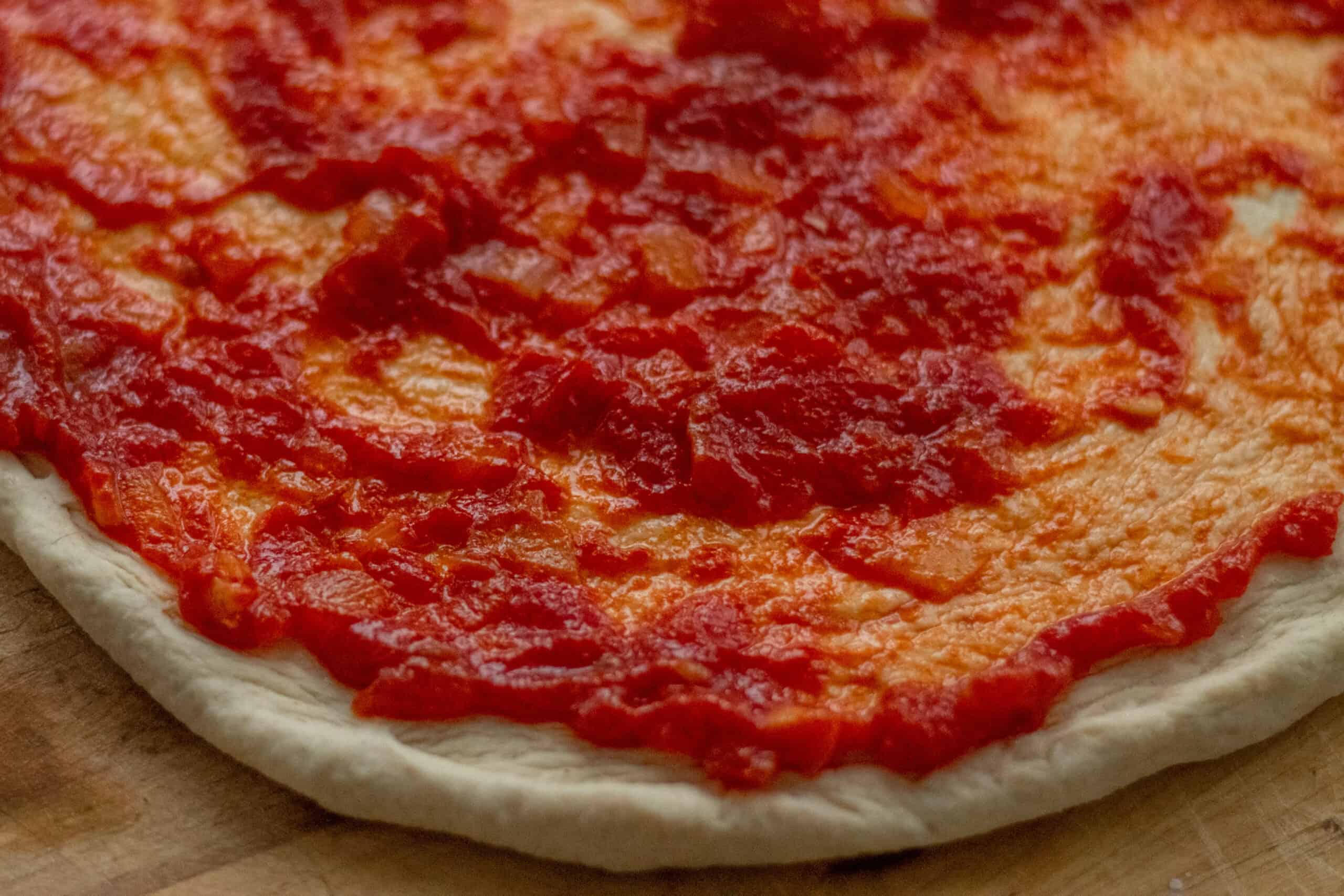 pizza sauce on a pizza base