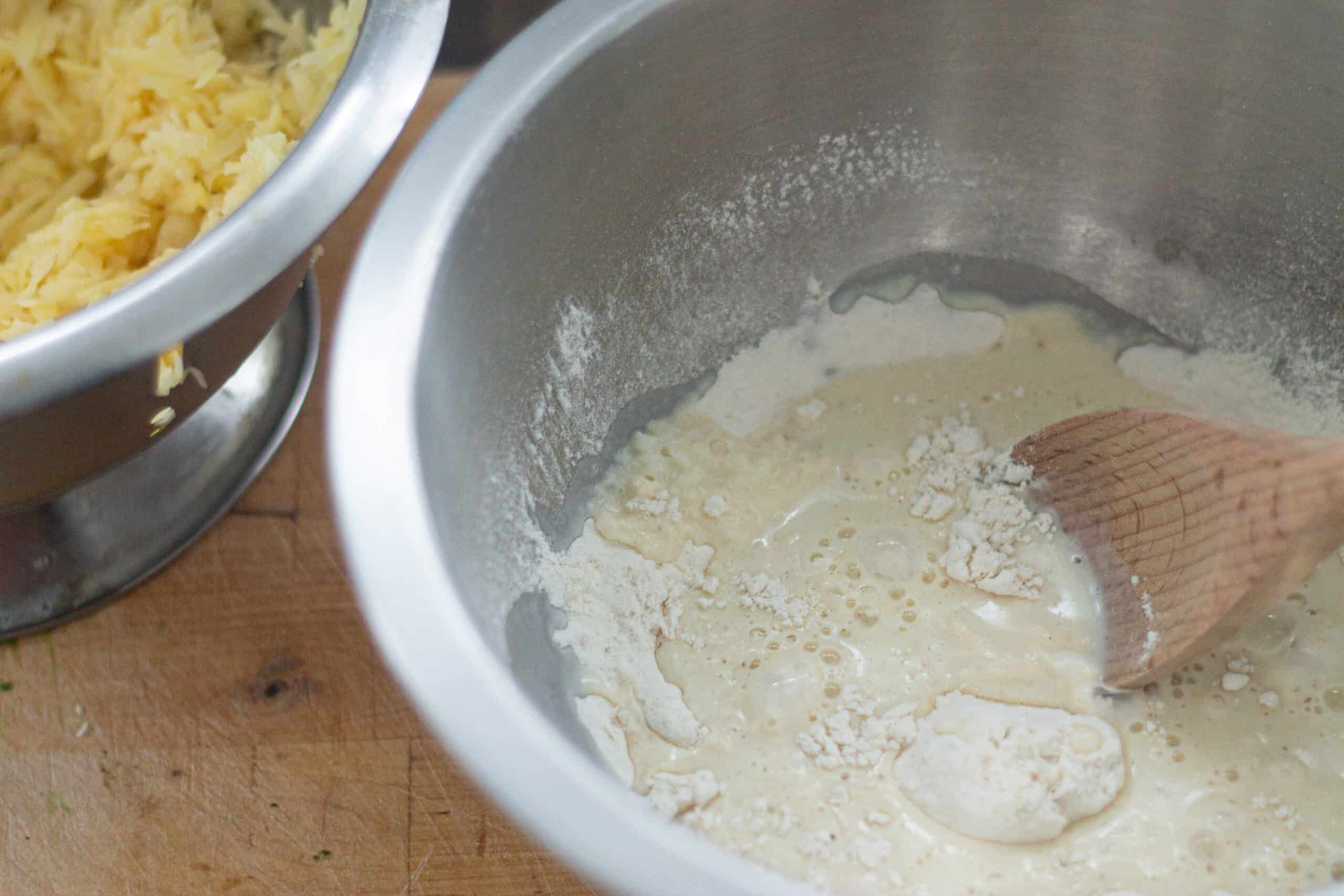 Mixing milk into flour