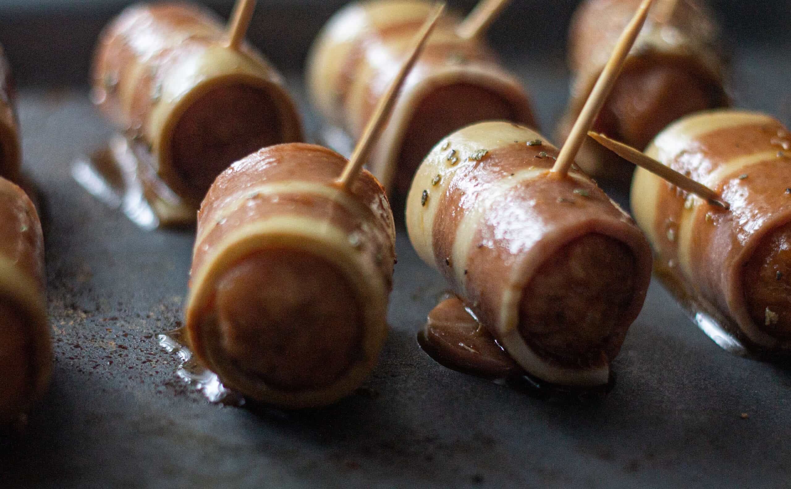 Pigs in blankets waiting to be baked