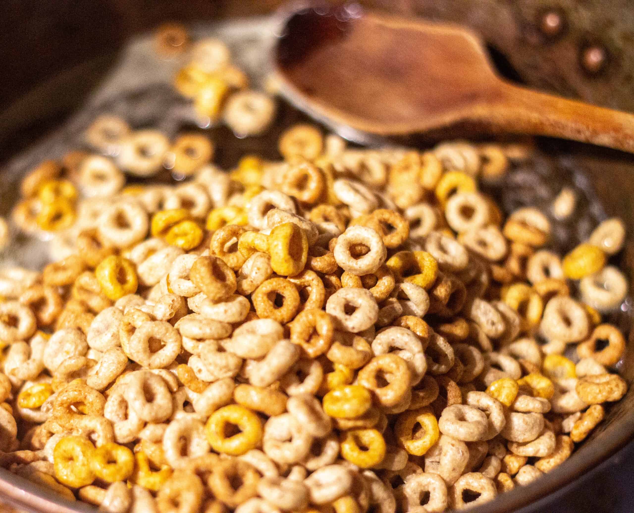 CHeerios in a frying pan with melted butter