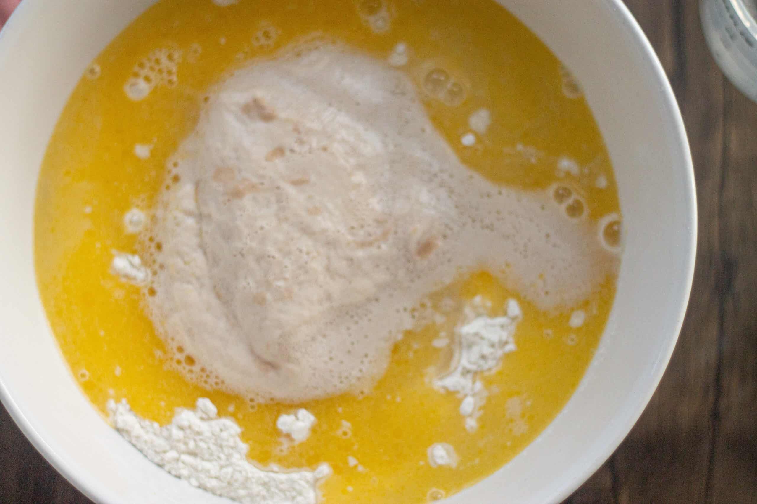 Adding yeast to melted butter and flour
