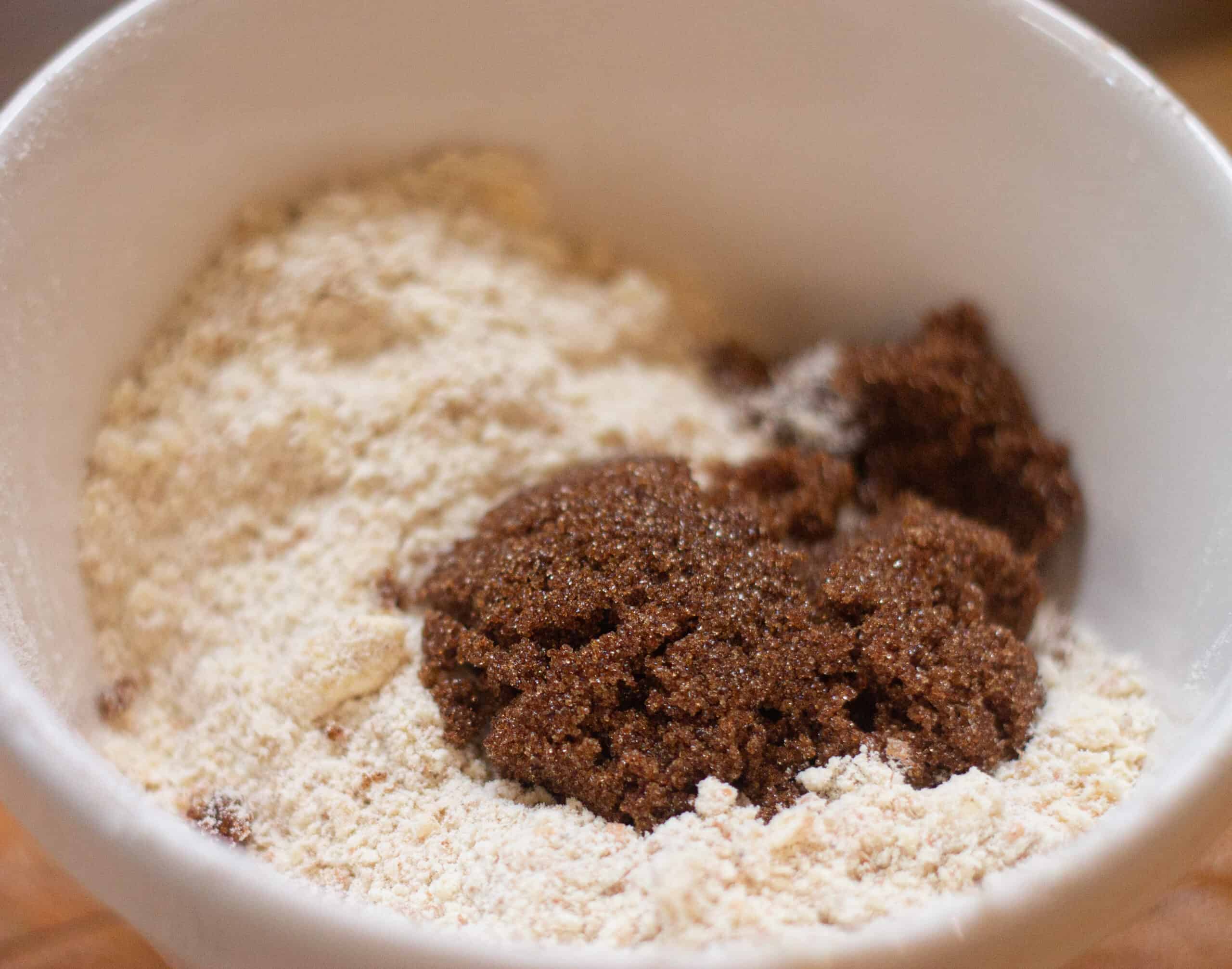 Adding the brown sugar to the crumble mixture