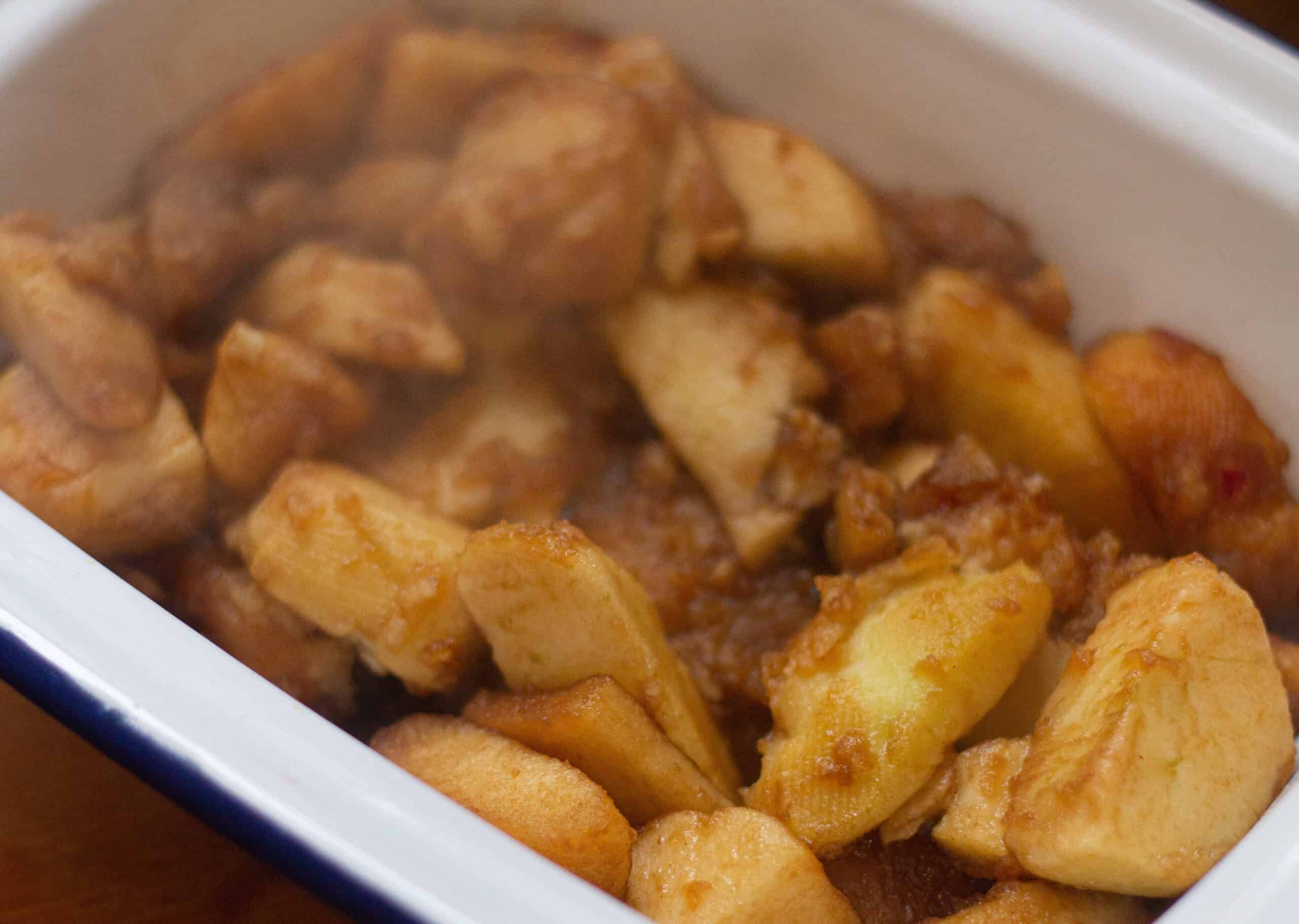 Place cooked apples in baking dish to cool