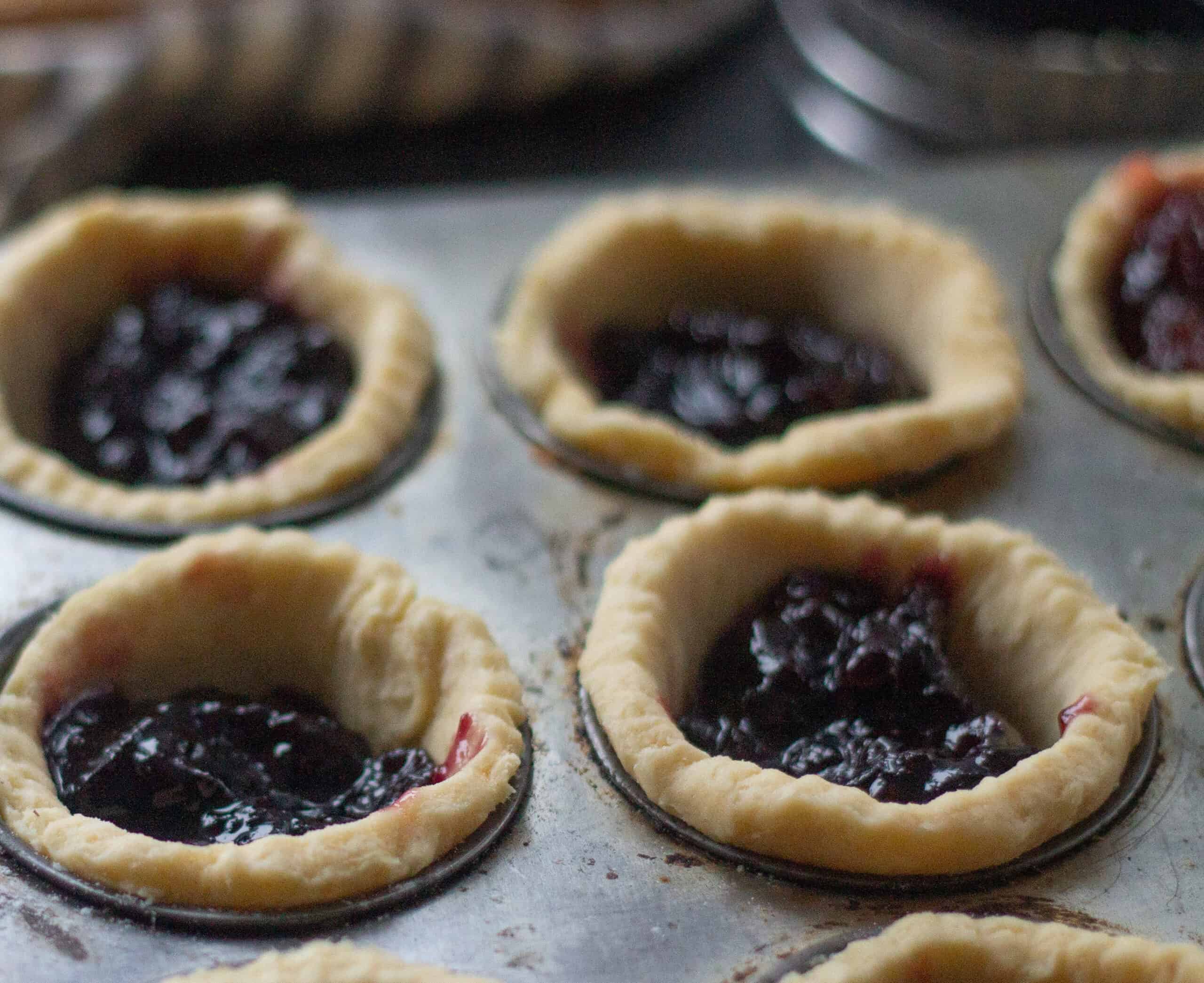 Filling jam tarts with jam