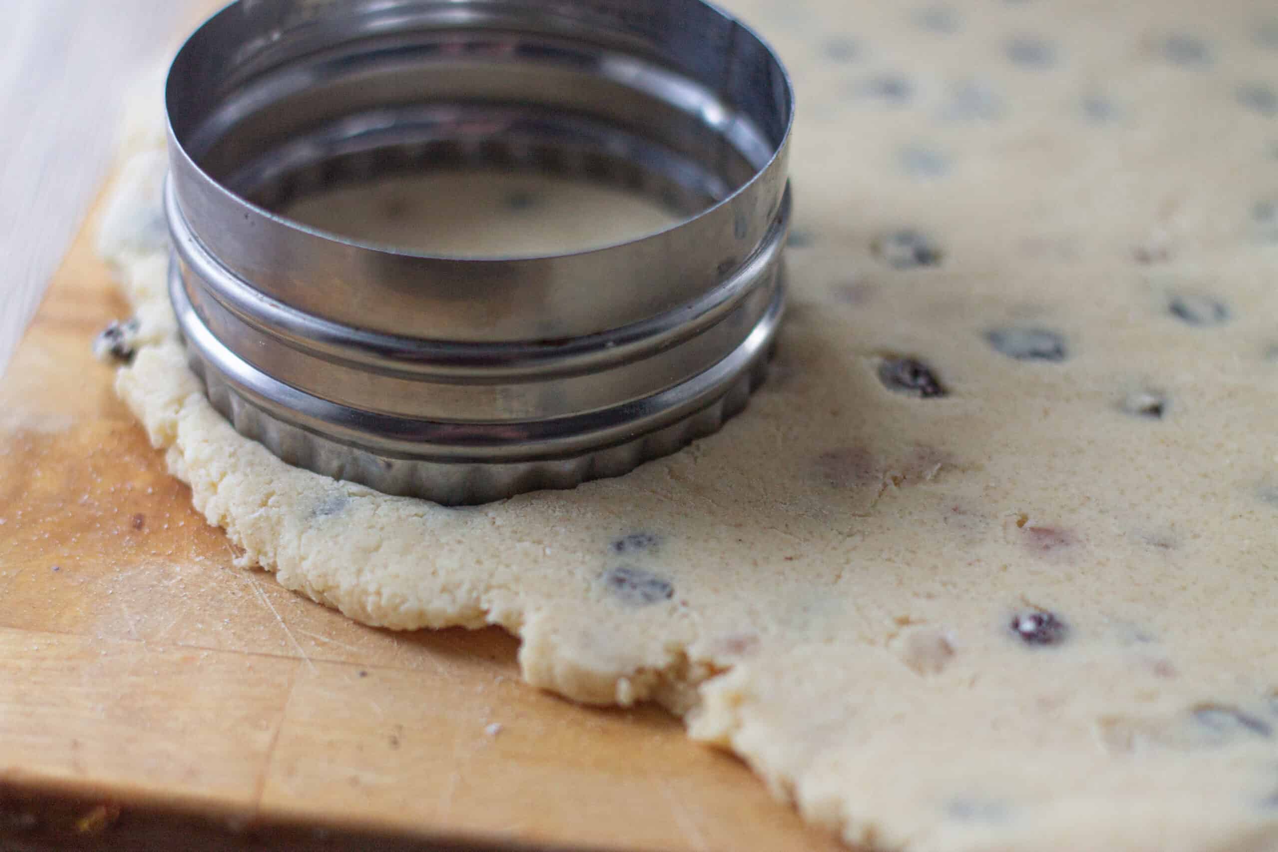 Rolling out dough to cut into cookies