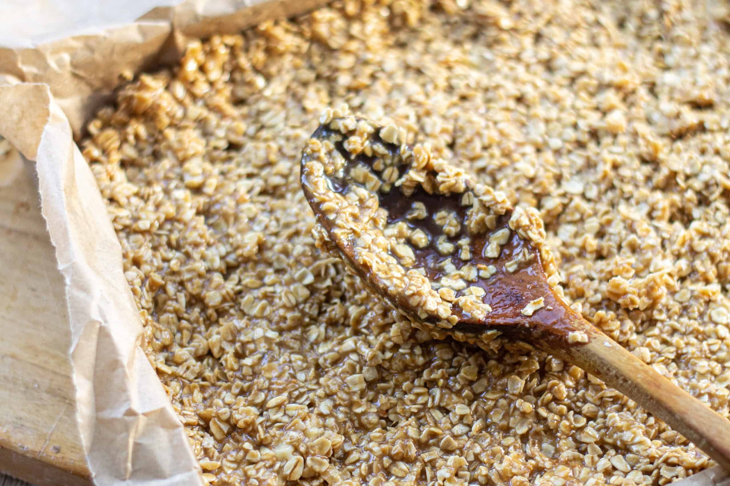 Pressing oats into a baking tin