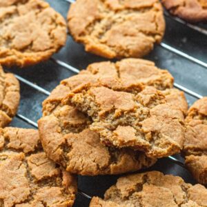 A cooling rack covered with ginger snap cookies