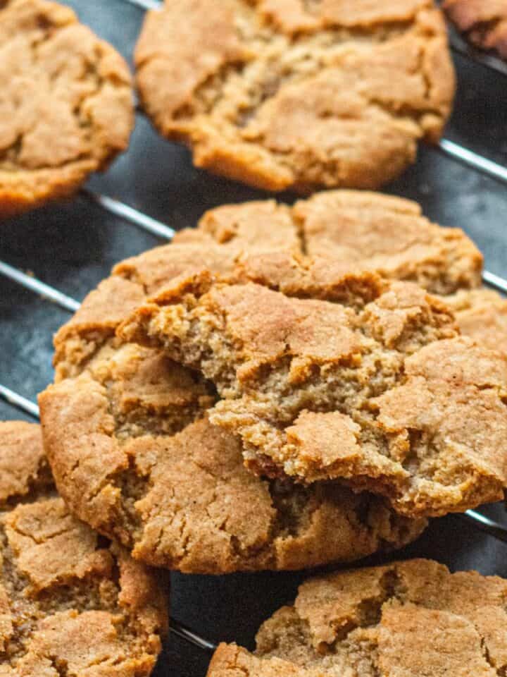 A cooling rack covered with ginger snap cookies