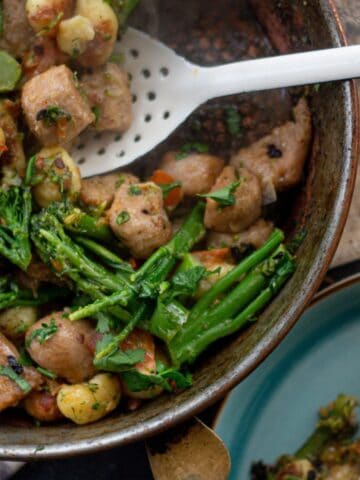Gnocchi with sausage and broccoli in a pan