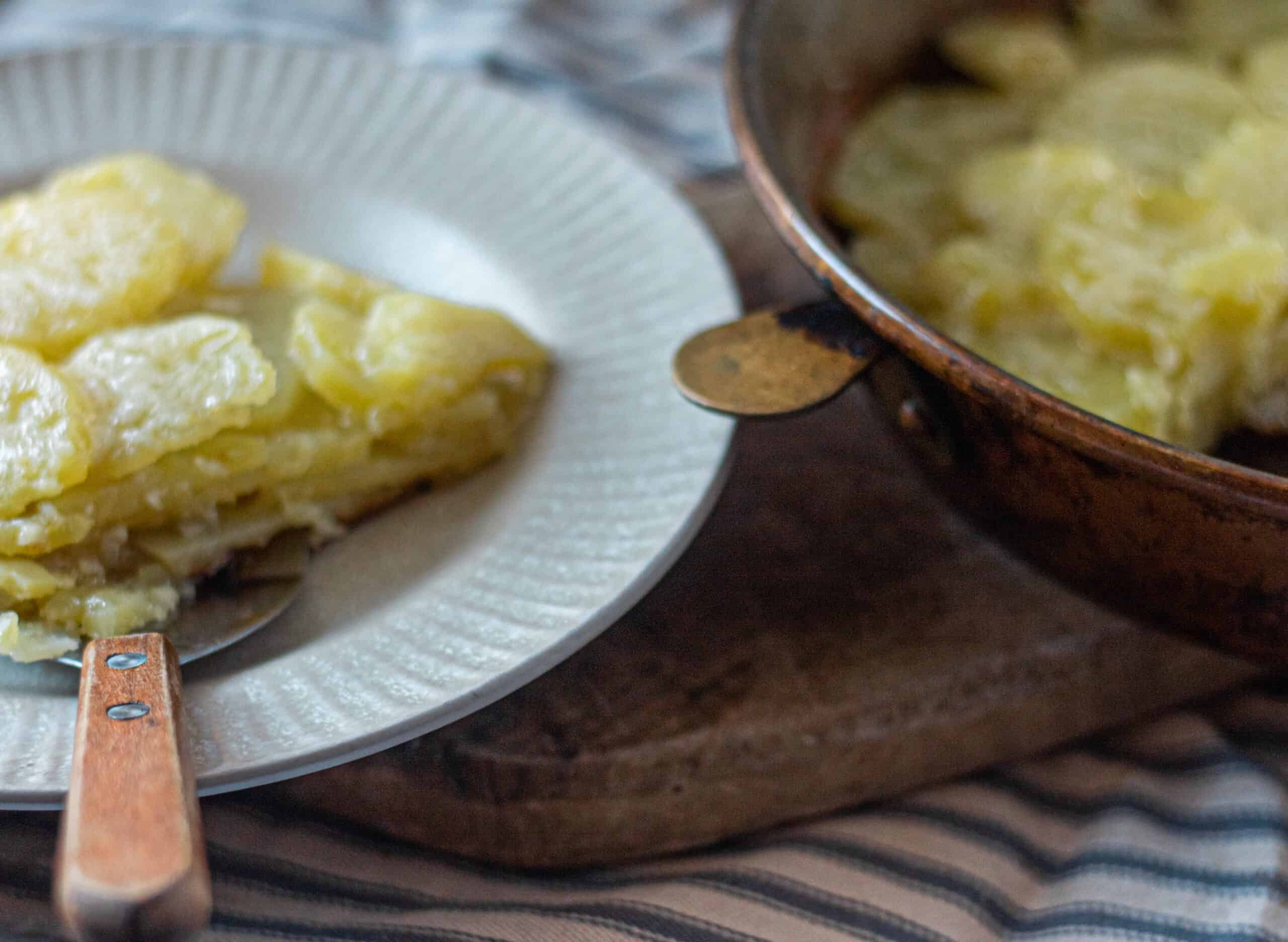 A dish of sliced potatoes