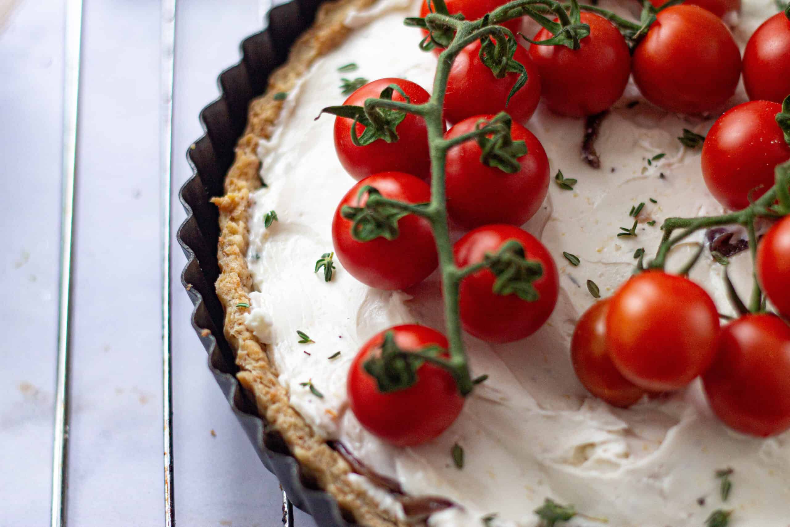 Placing tomatoes on the tomato tart